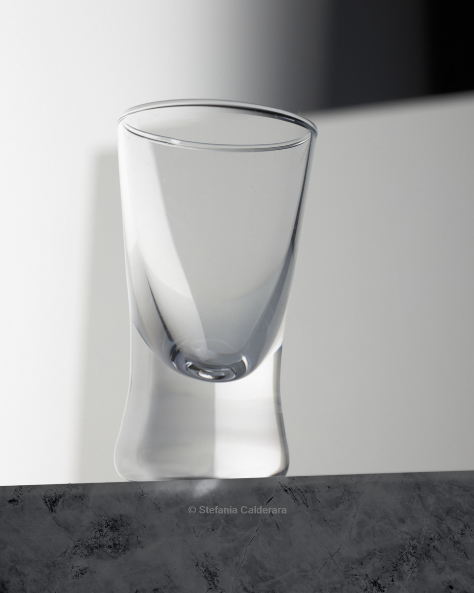 Just a cool shot glass on white 3d background, with nice reflections. Image by Stefania Calderara