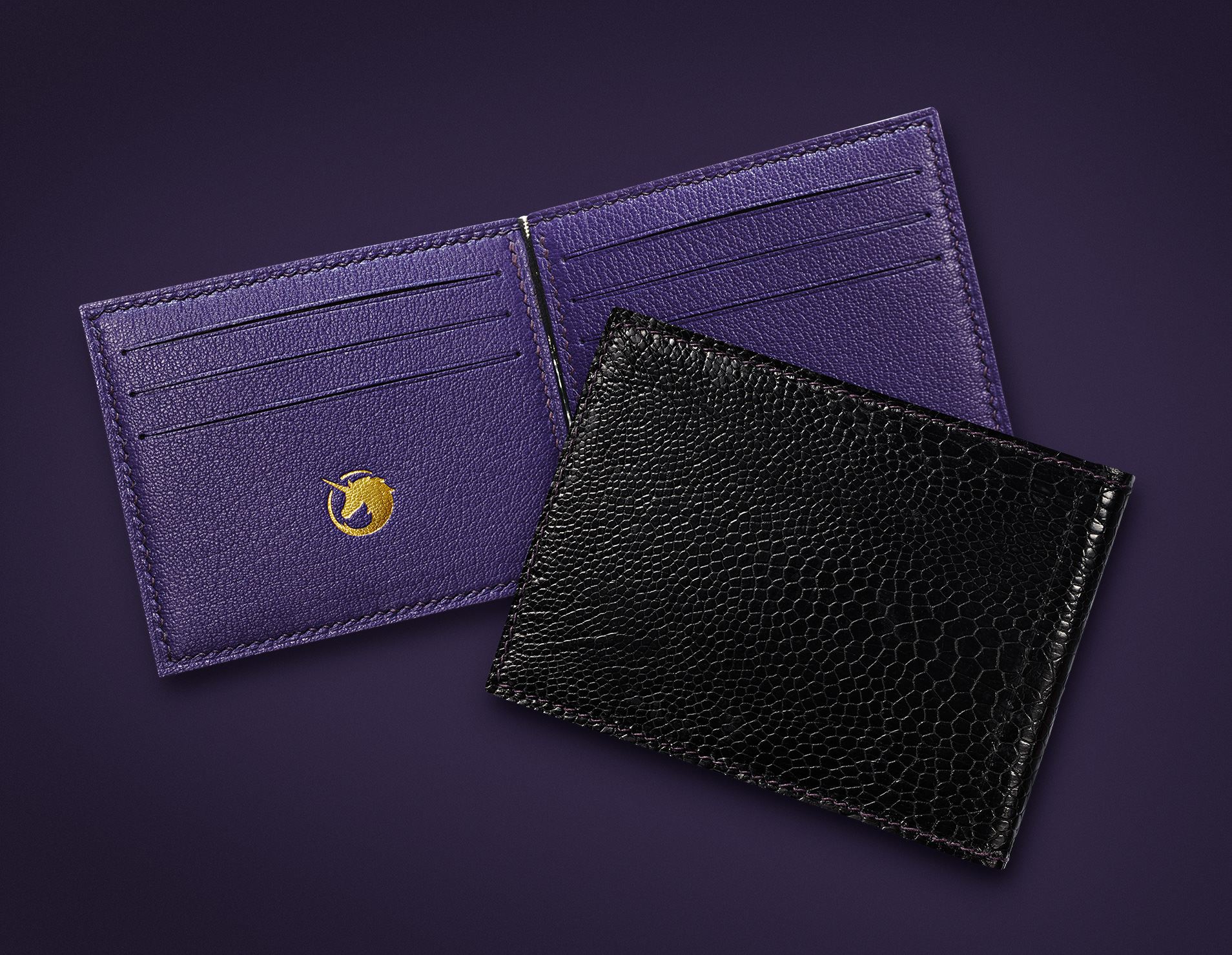 Luxury accessories Lifestyle image of ostrich and goat leather wallet by The Purple Seal - Black and Royal Purple
