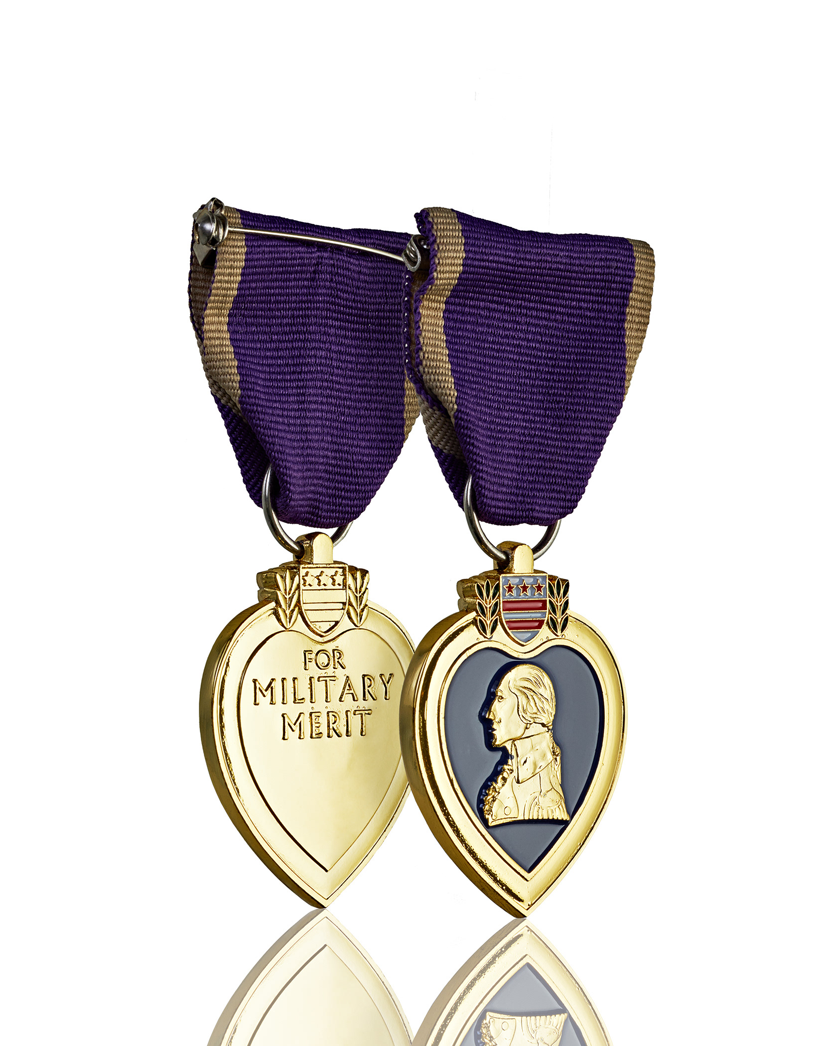 Still life image of golden Purple Heart medal for military merit, on white background for ecommerce. Photography and retouching by Stefania Calderara