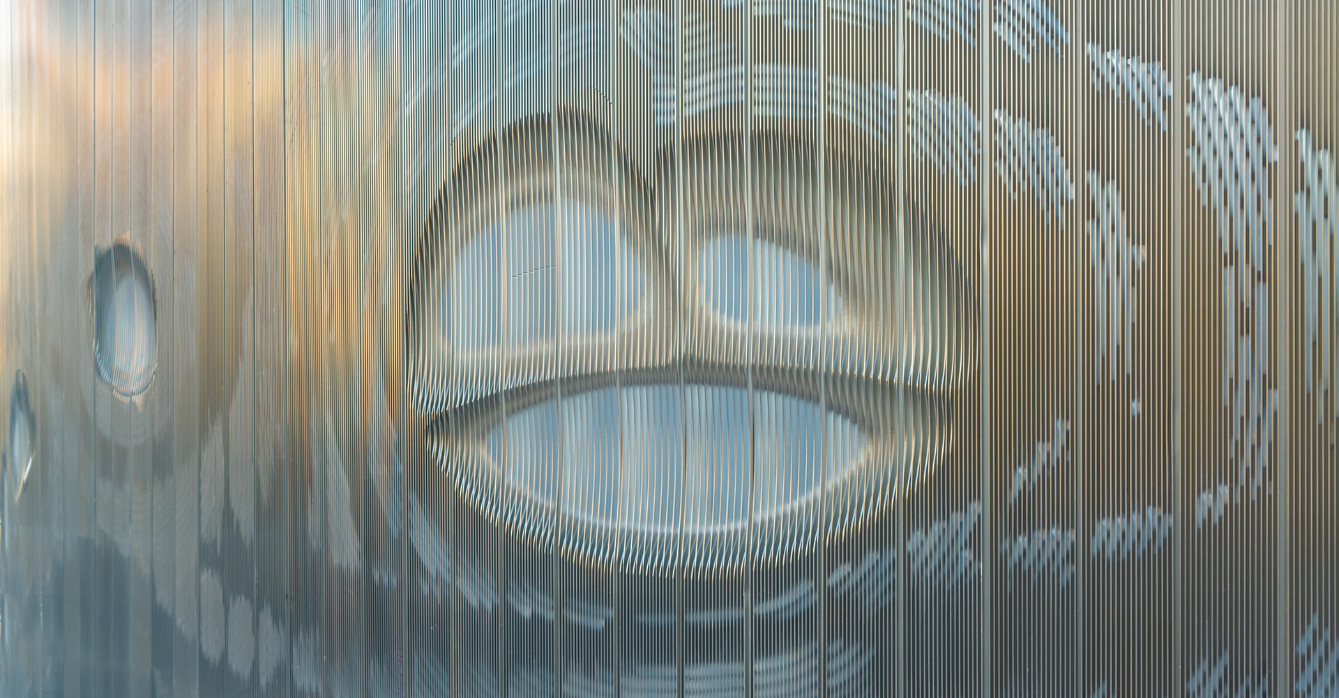 Late afternoon reflections on aluminum wall, El Paso TX