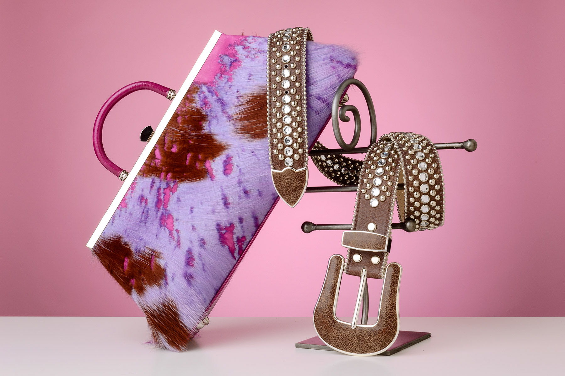 High fashion cowhide purse and studded belt | Photo © Scott Weaver