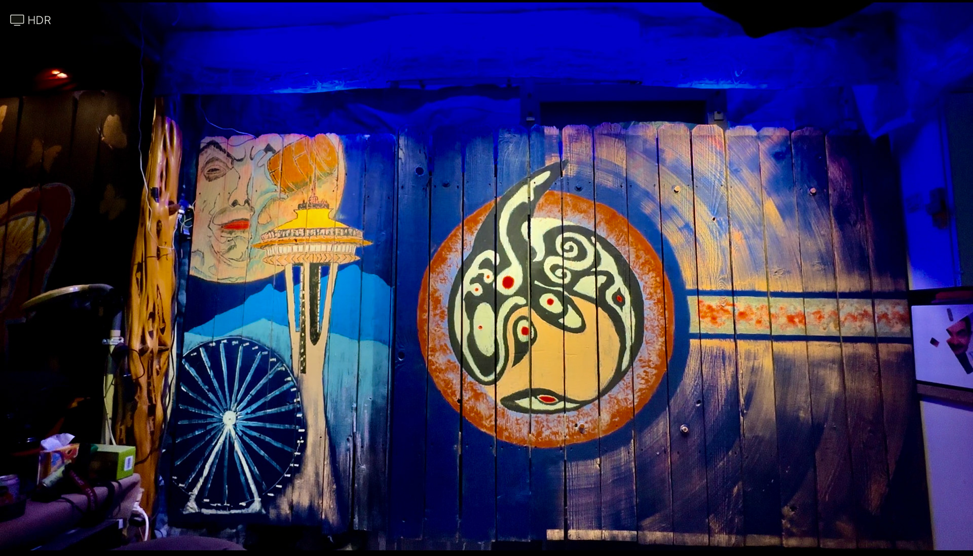 Northwest Theme.  Center Orca Totem patterned after the Snoqualmie Tribe of Washington State.  This acts as a sliding door that exits to the pario. 