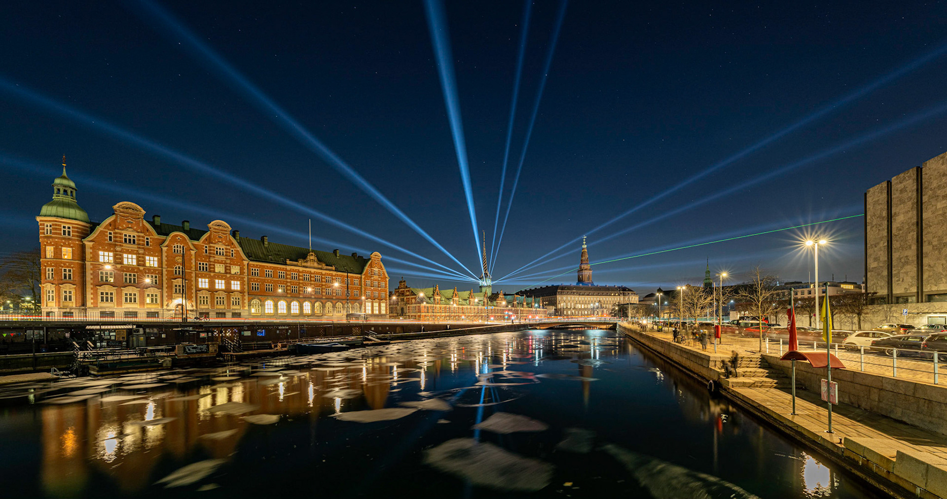 Beautifully lit Børsen and Parliament i Copenhagen during the Light Festival 2021