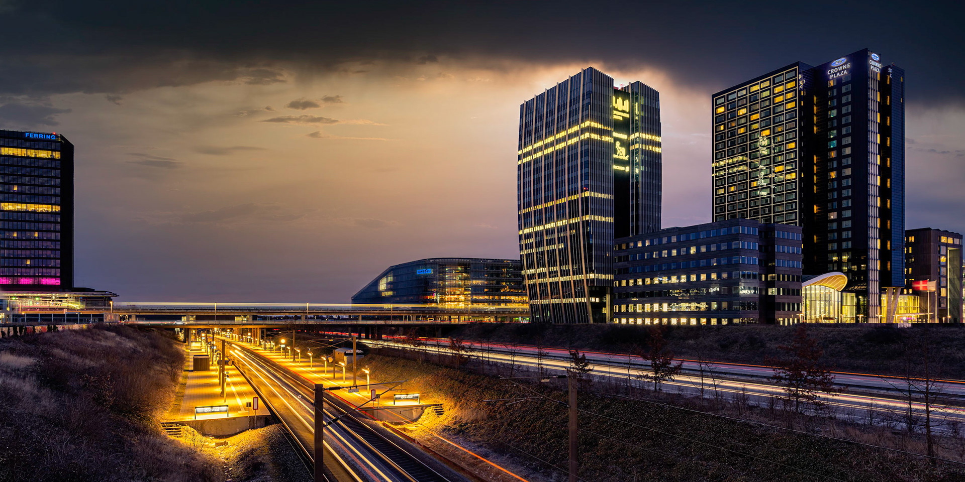 The new train station at Ørestad Amager on a cold winter evening as the sun set.
