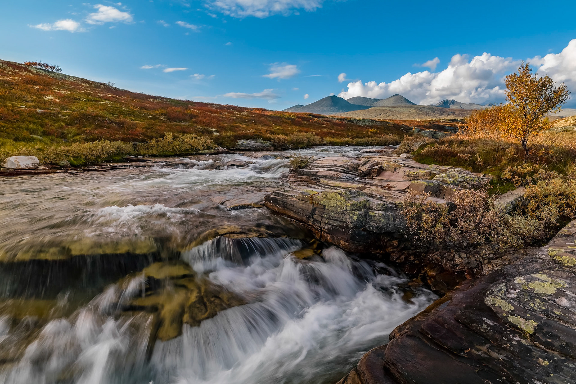 Norway, Storula River (Elv) just before the Storulfossen waterfall is a magnificent place to spend an afternoon with your camera. Lots of different angles and motives over the same theme.My wife enjoyed reading a book while I was rumbling about finding new perspectives, all in all we had a wonderfulafternoon and the evening was completed with a tasty dinner and good wine (actually excellent Rioja) at the Mysuseter Högfjelshotel and Spa.