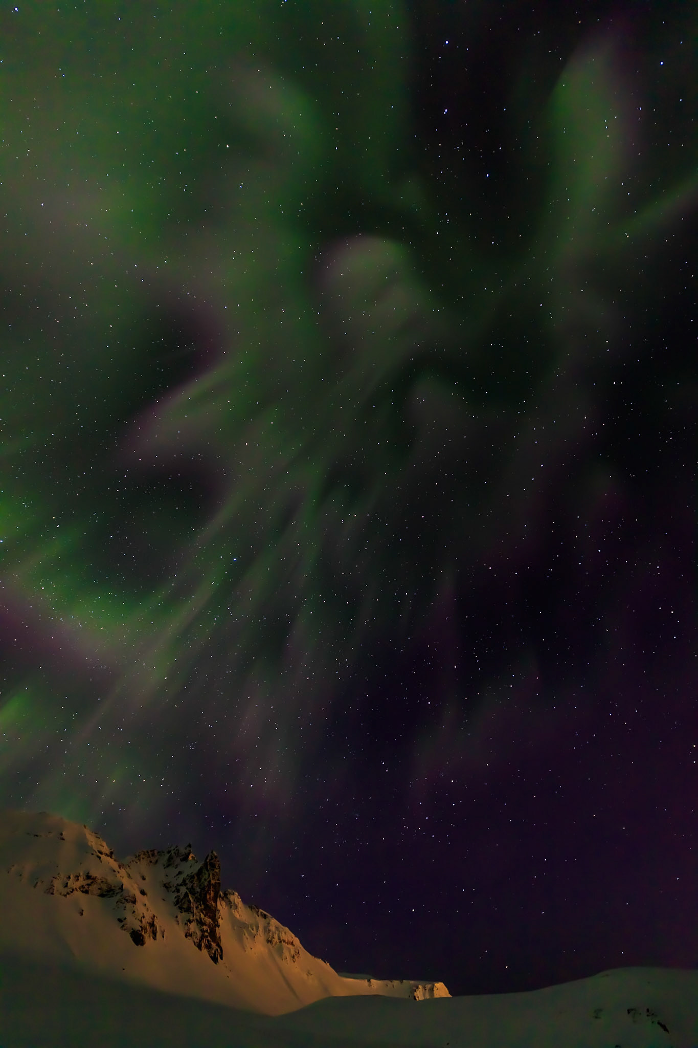 An angel apears in the Aurora Borealis / Norhtern Lights in the sky above Vik Iceland