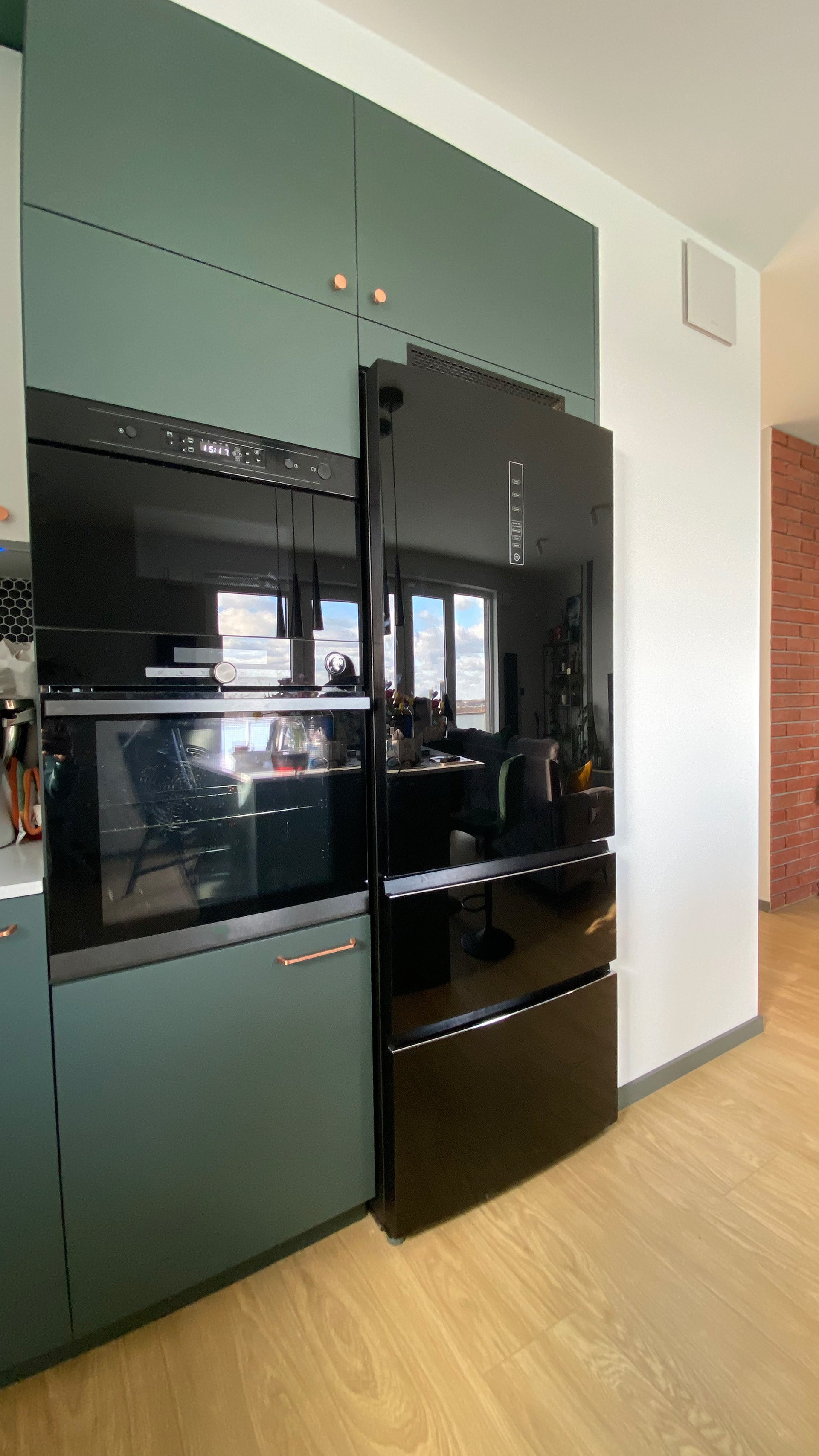 Fridge and oven integrated in kitchen
