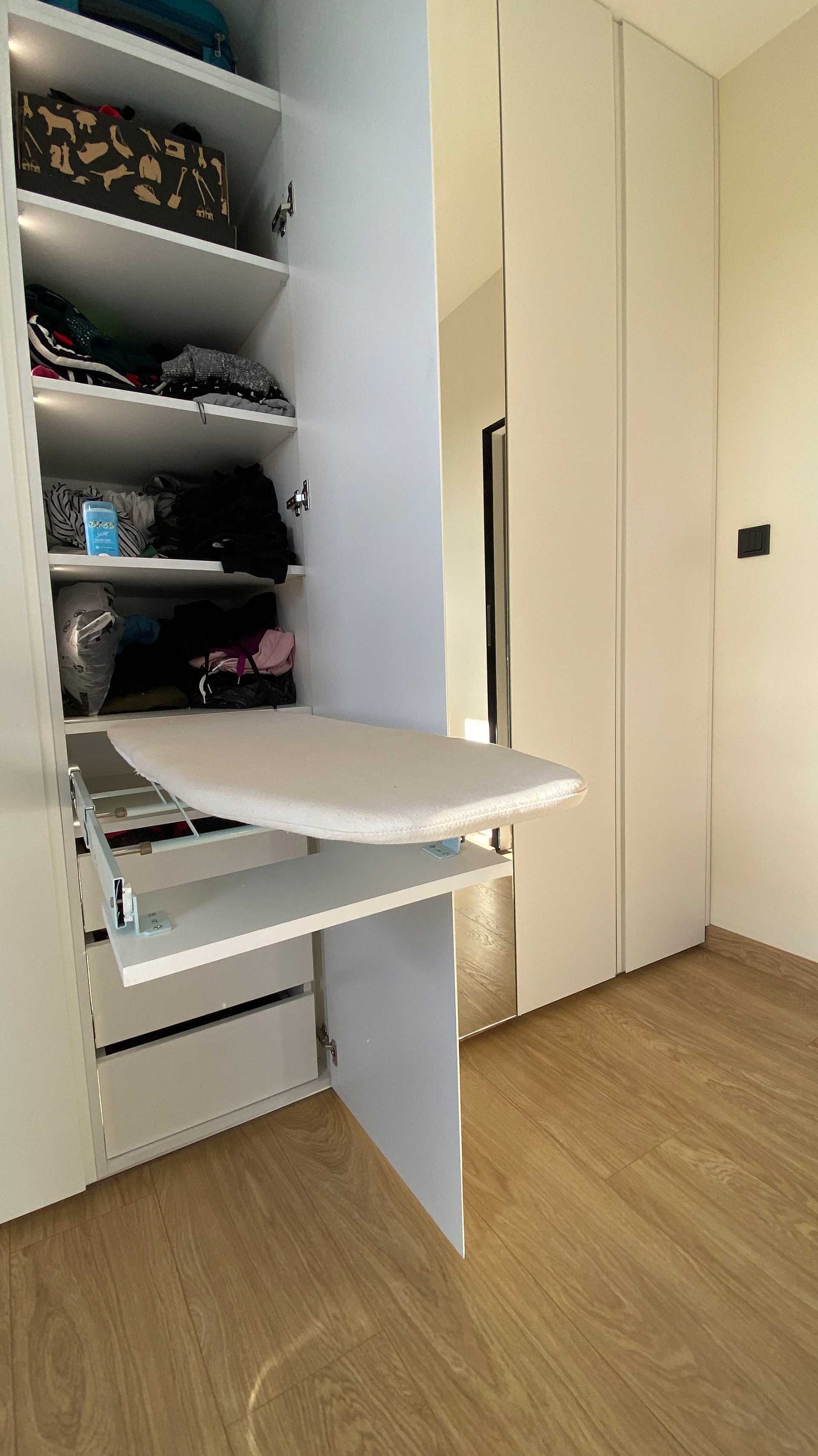 Wardrobe with integrated ironing board