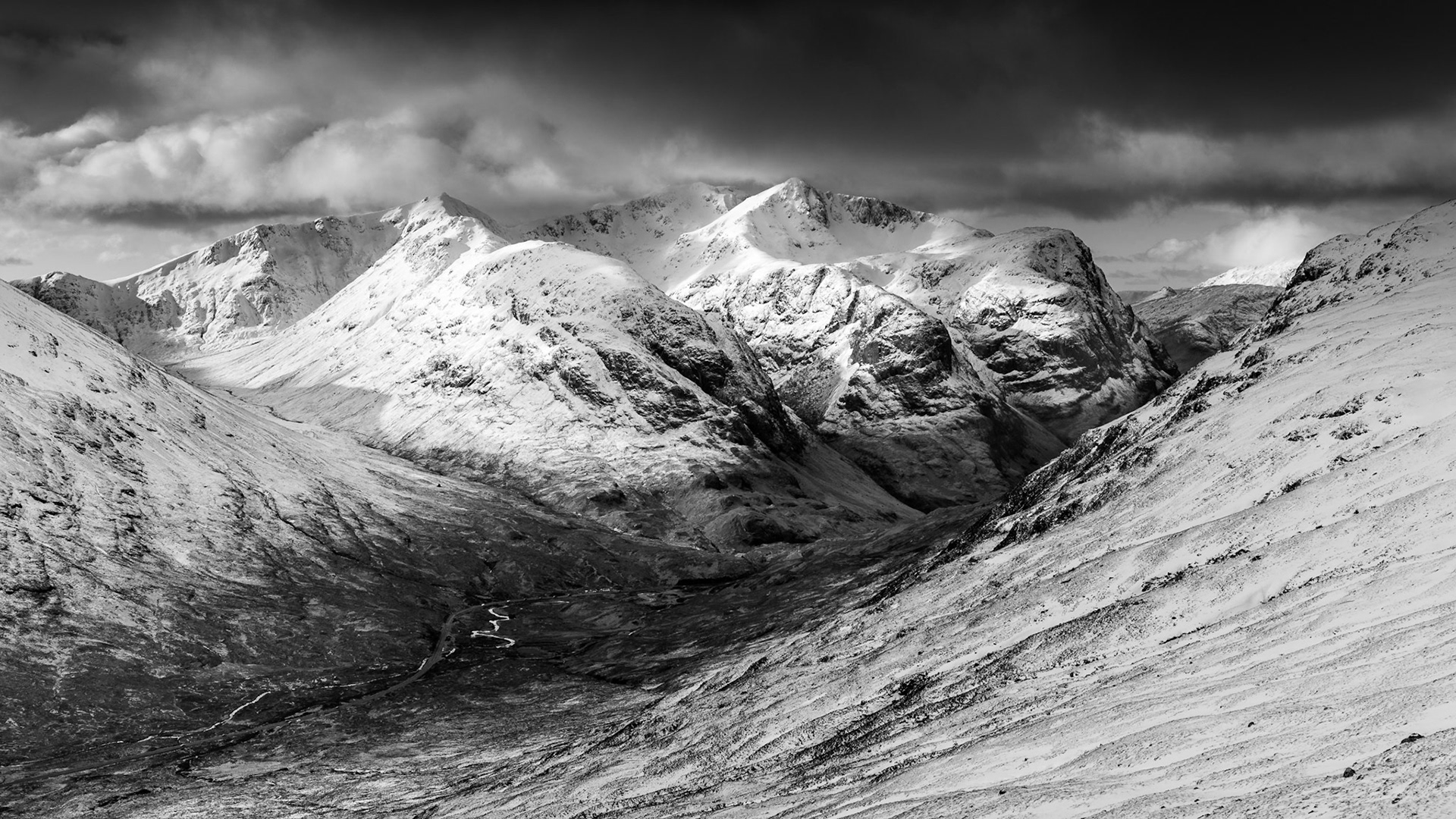 A Winter morning looking onto on The Three Sisters, Glencoe in the Scottish Higlands from the summit of Stob Mhic Mhartuin