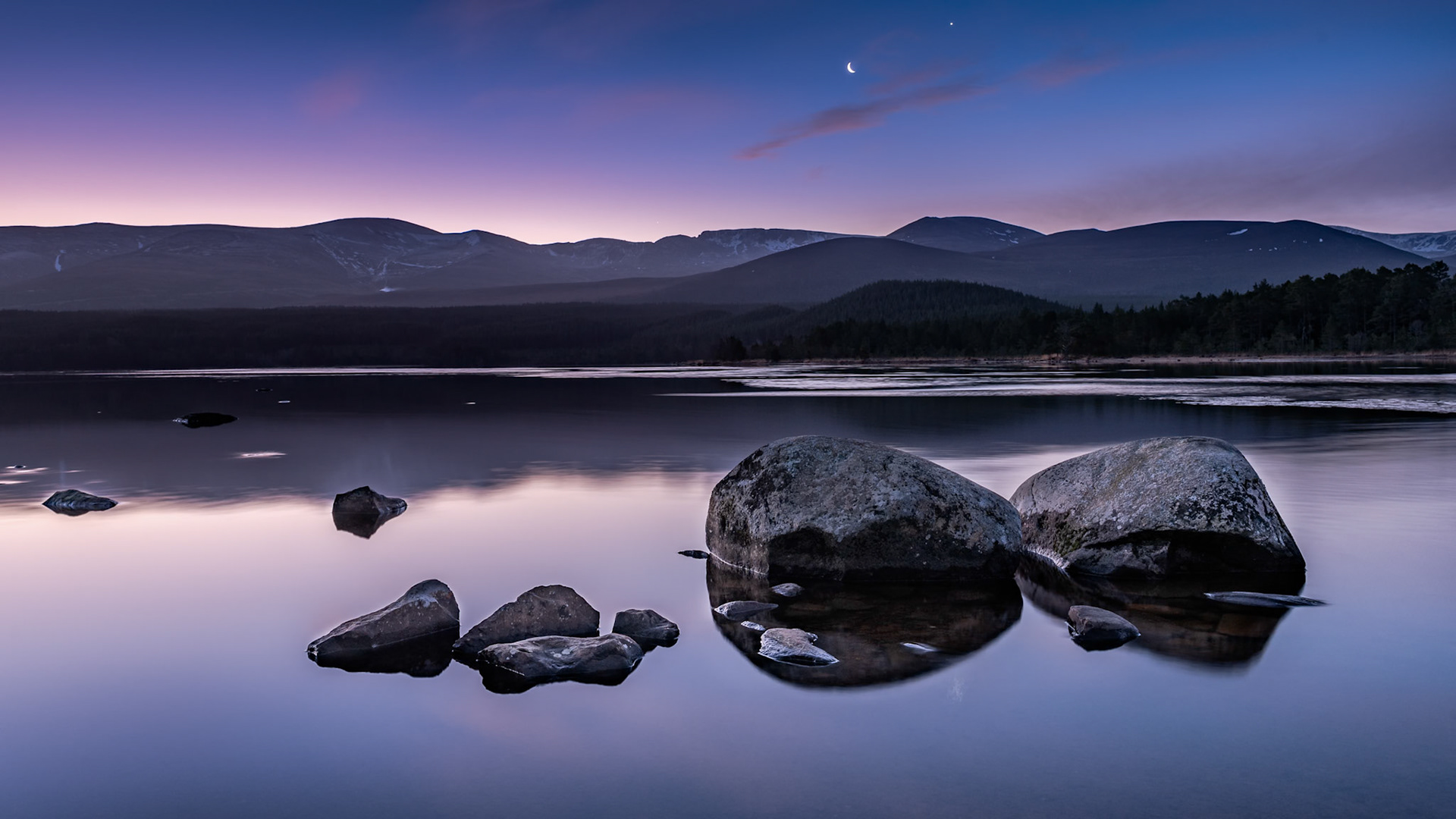First light over Loch Morlich in the Cairngorm National Park in the Scottish Highlands