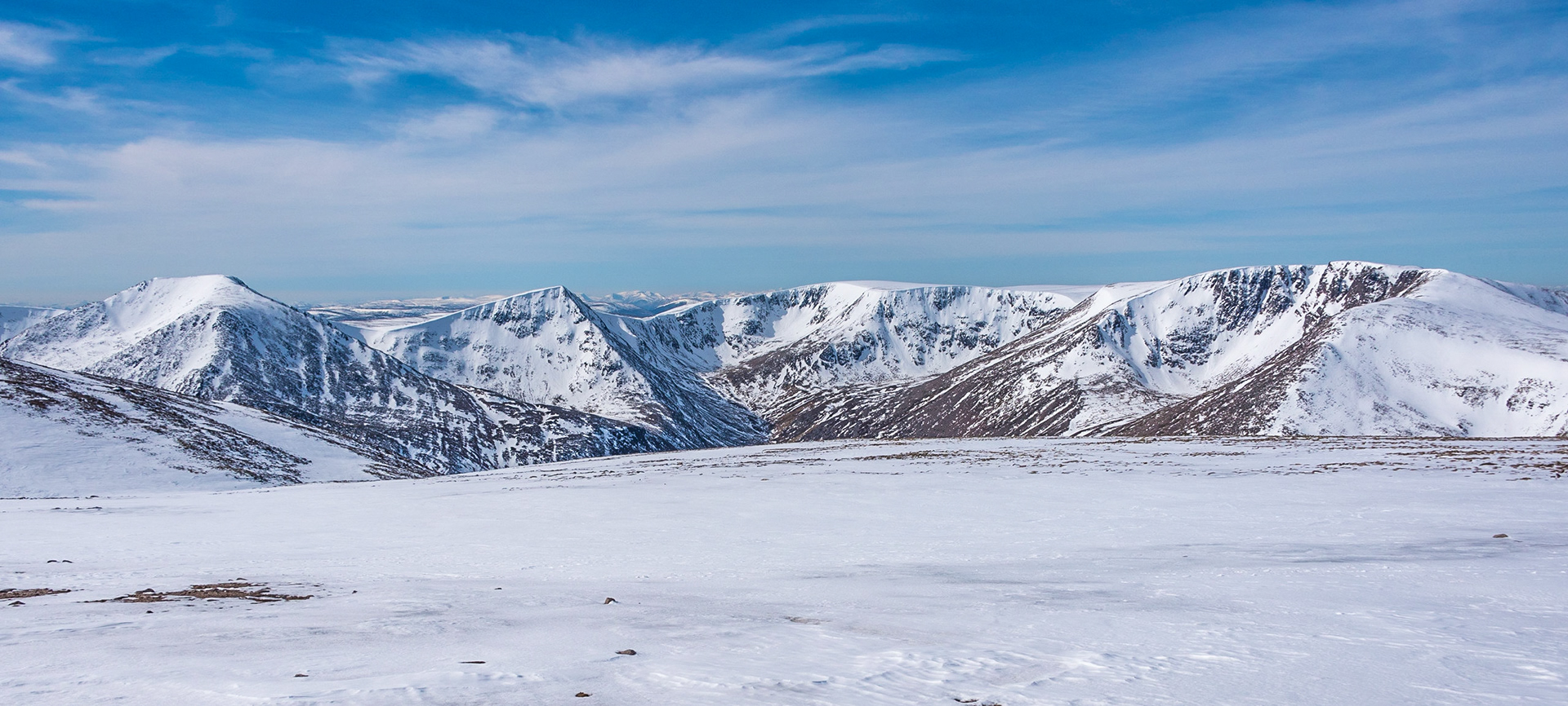 Looking out across the Cairngorm in winter to Angels Peak(1258m) and Braeriach (1296M)