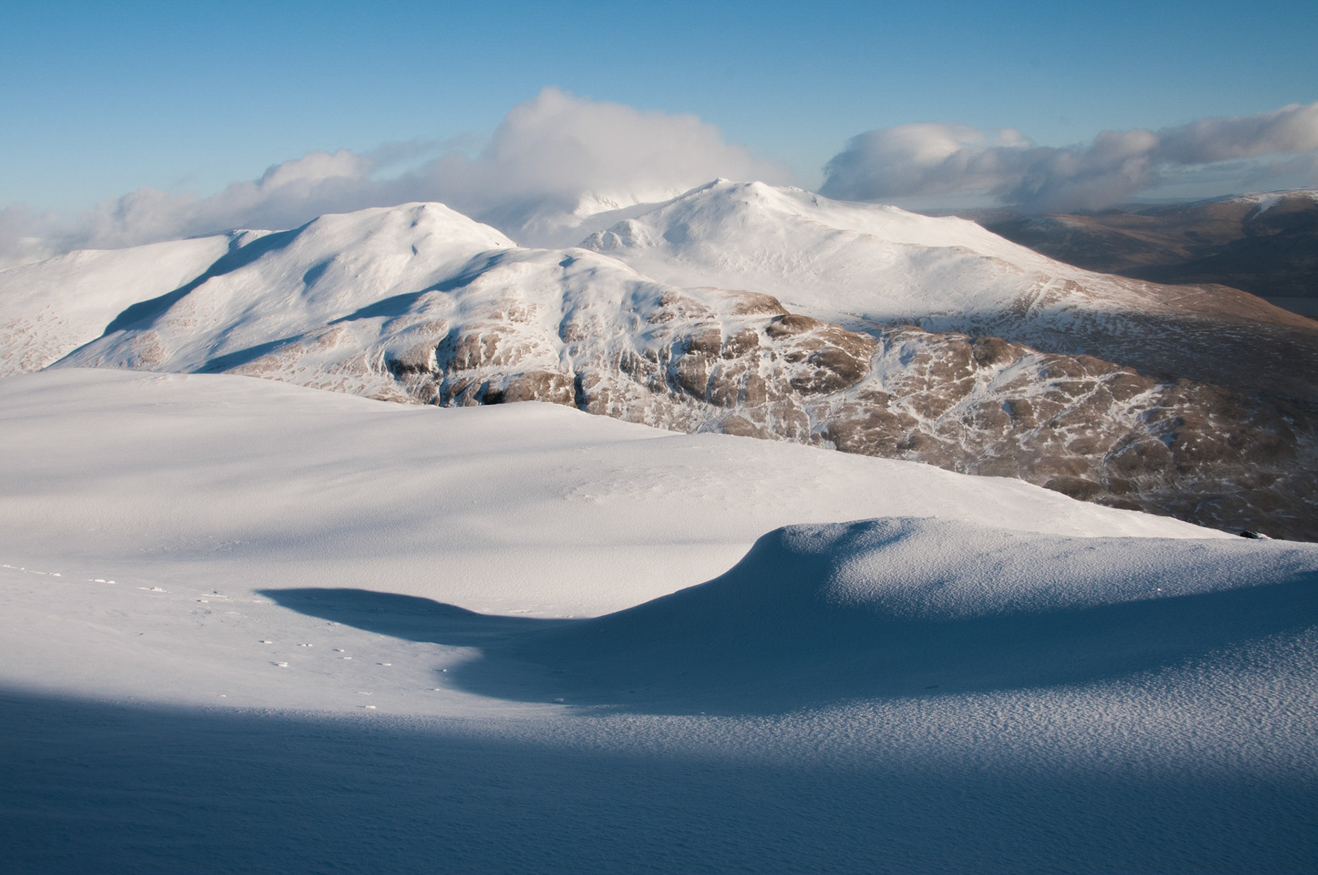 The snow covered tops of the Ben Lawers range of hills in Perthshire