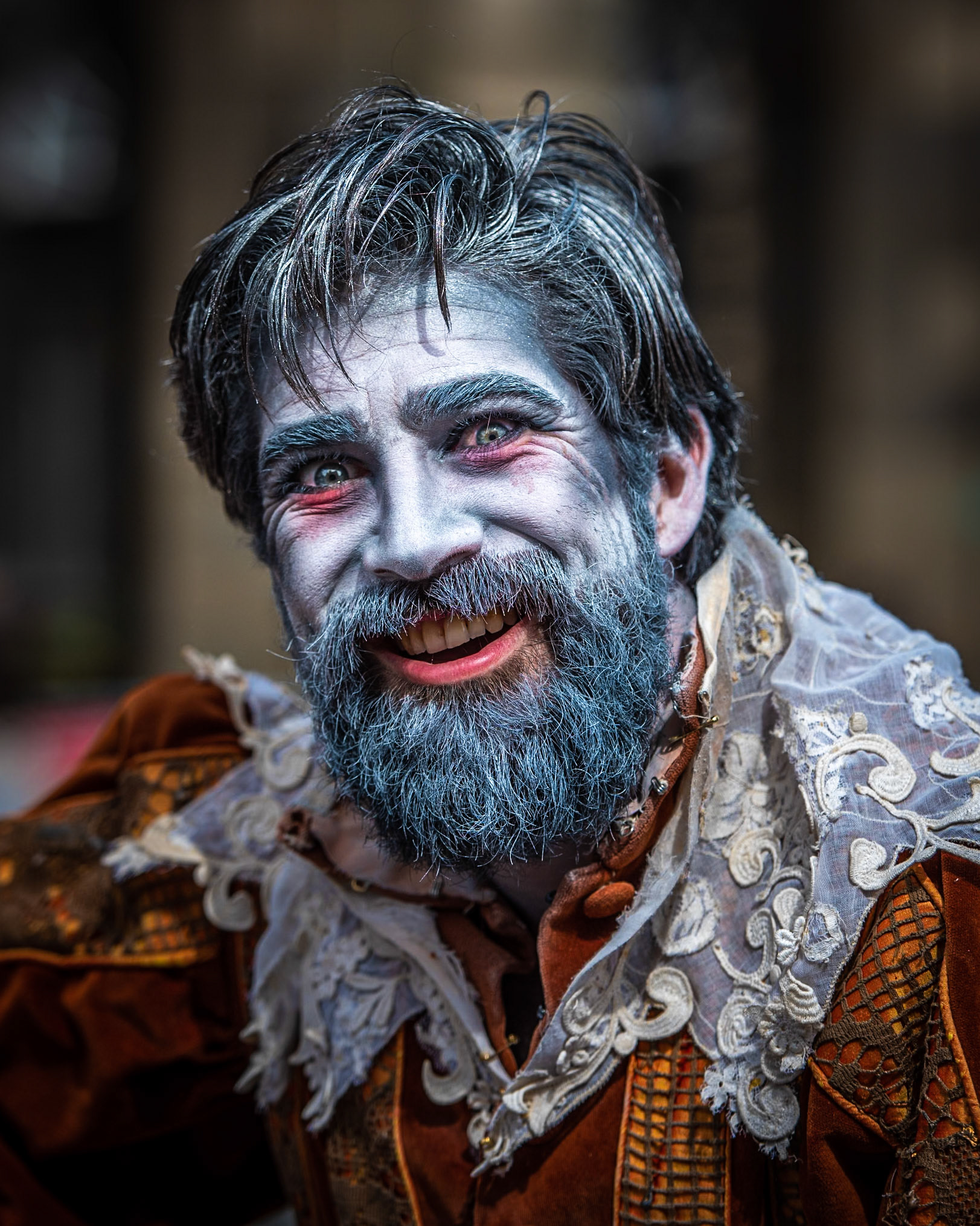 Street entertainers and actors entertain the public and advertise their shows in Edinburgh's Royal Mile during the Festival Fringe season.
