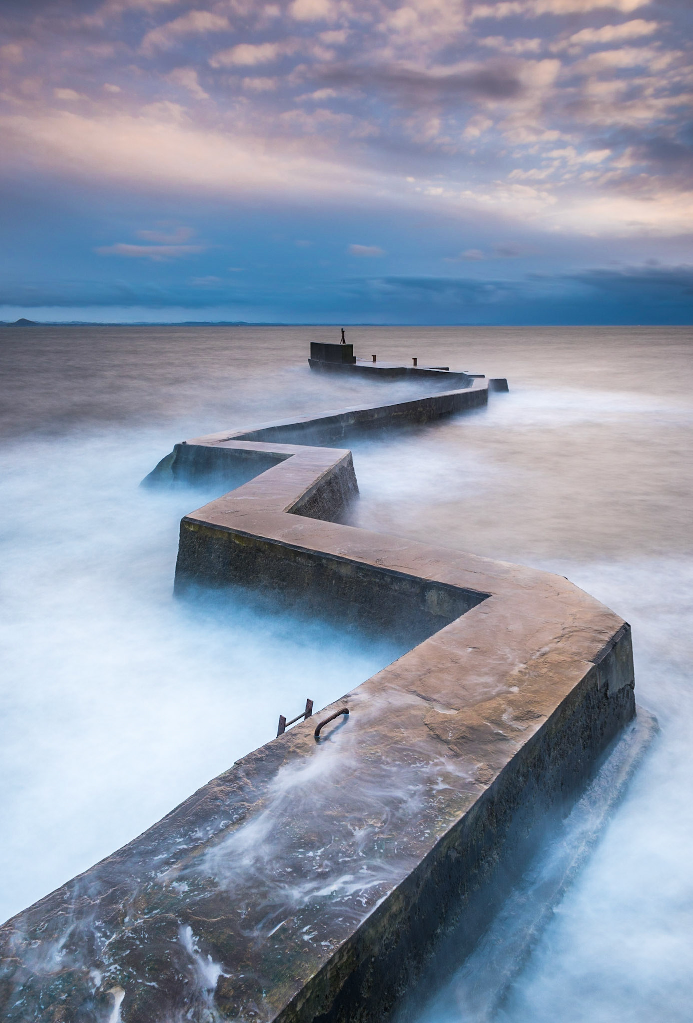 Sunset at the breakwater in St Monans in Fife, Scotland