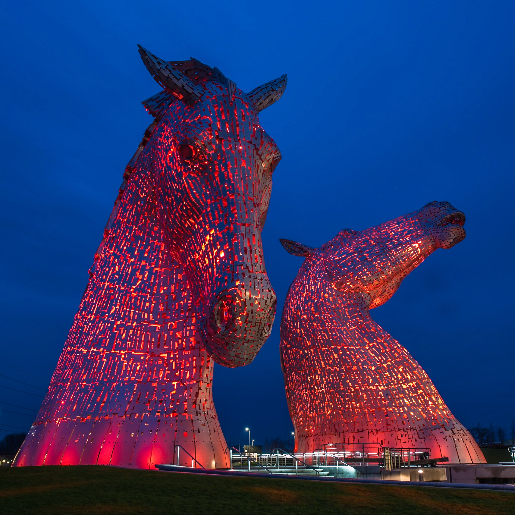 The Kelpies are 30-metre-high horse-head sculptures by artist Andy Scott and are located in Helix Park Falkirk next to the Forth and Clyde Cana