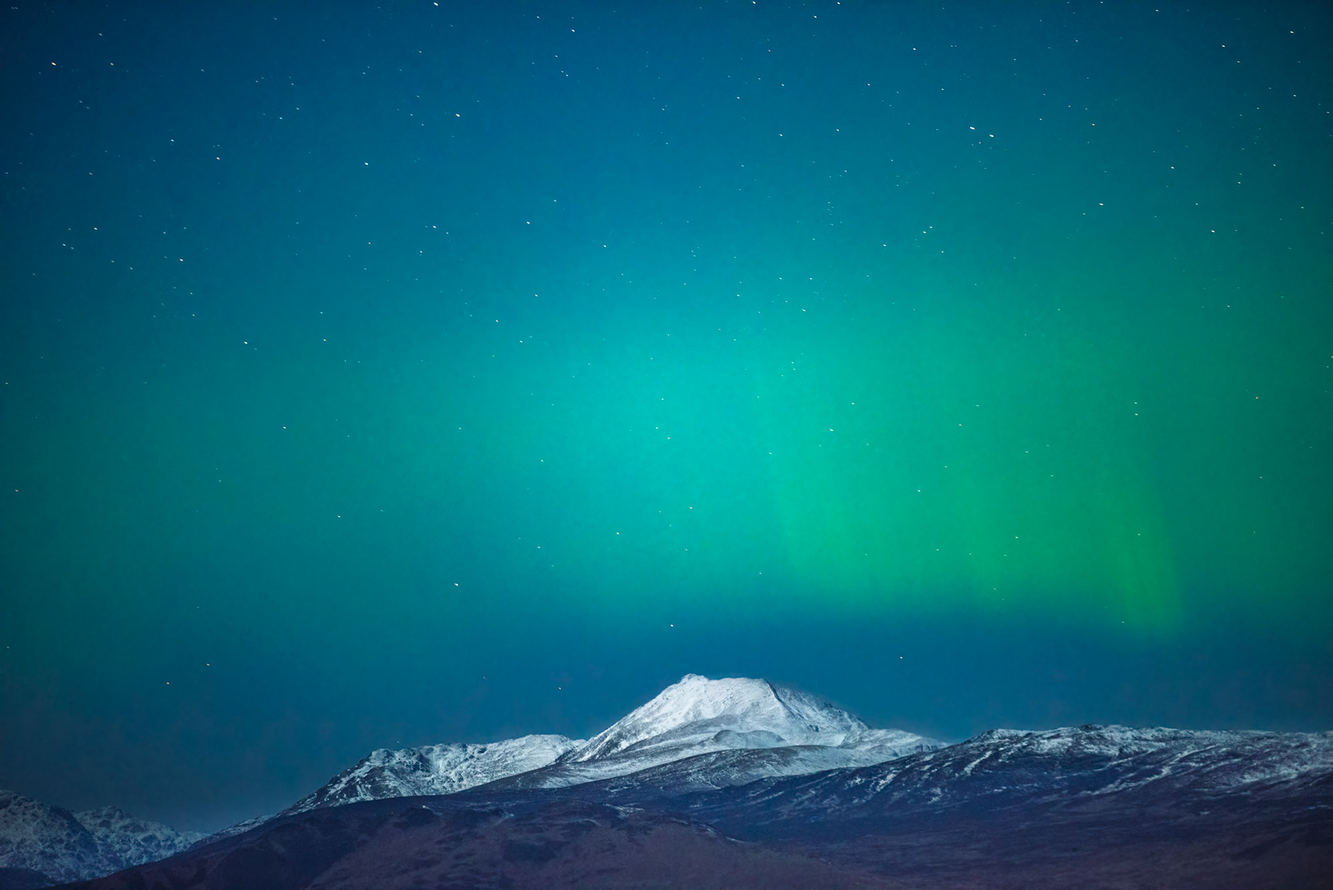 Aurora over a snowy Ben Lomond
