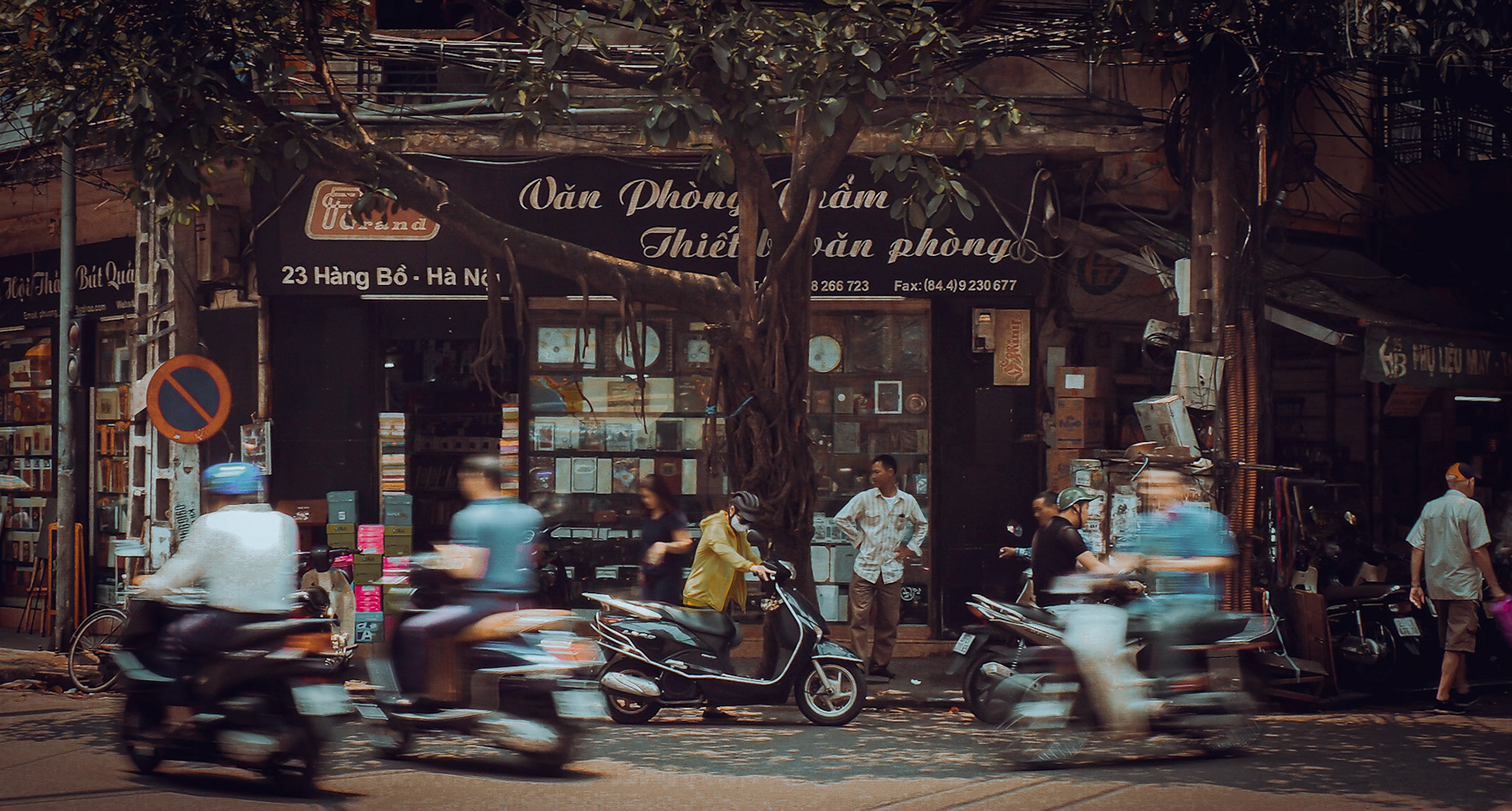 motorbikes blur in old Hanoi