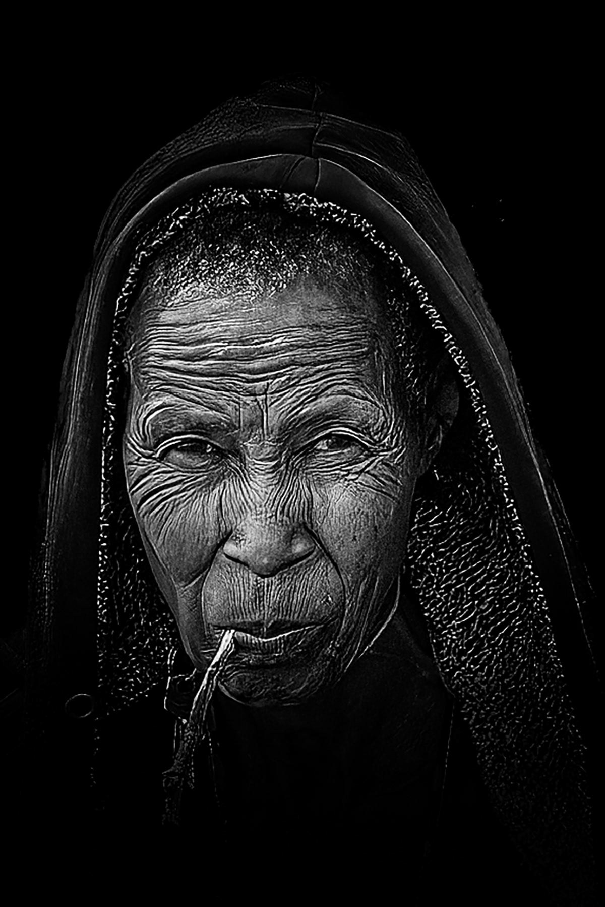 Old lady in Tanzania, surprised to have to pose for a photograph