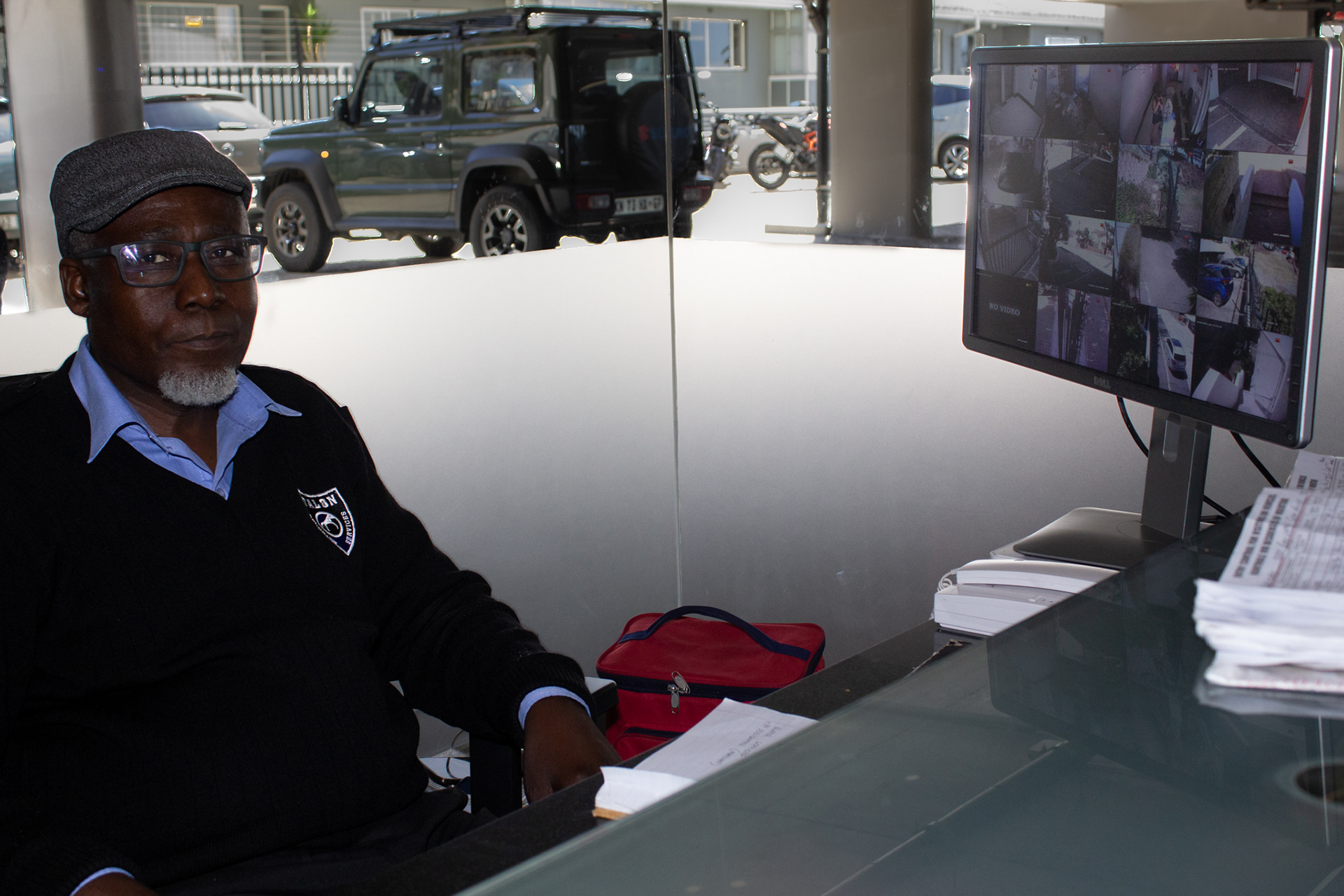 Patrick Ndawo posing at his workstation