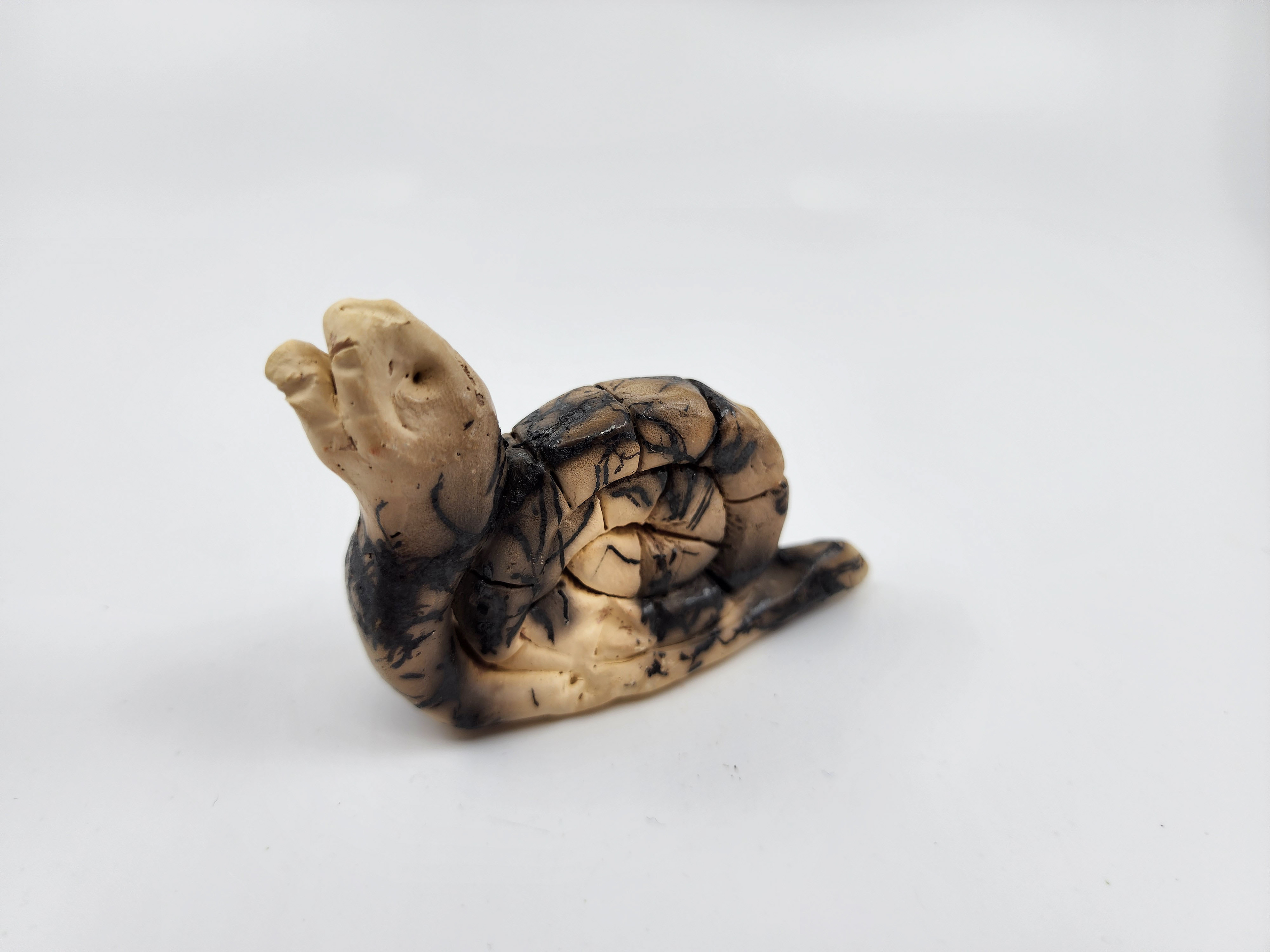 Stoneware with burned hair surfacing