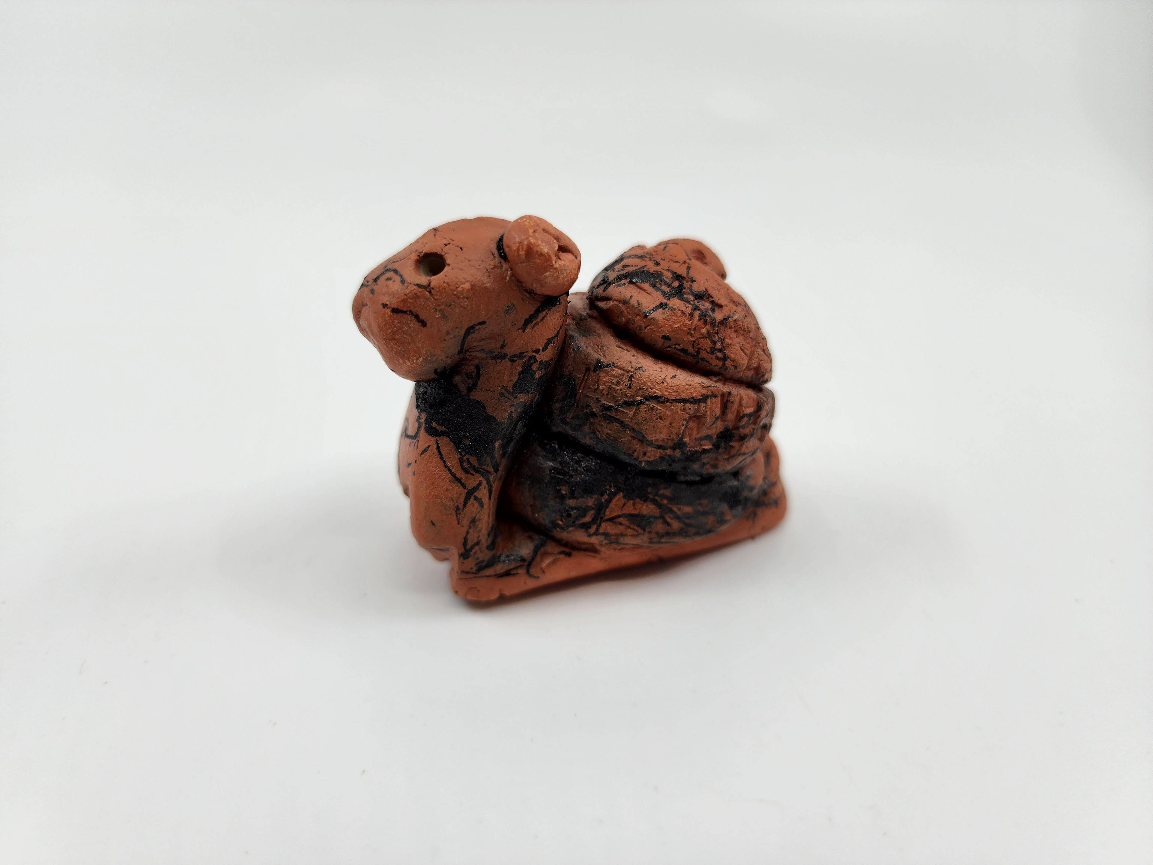 Earthenware with burned hair surfacing