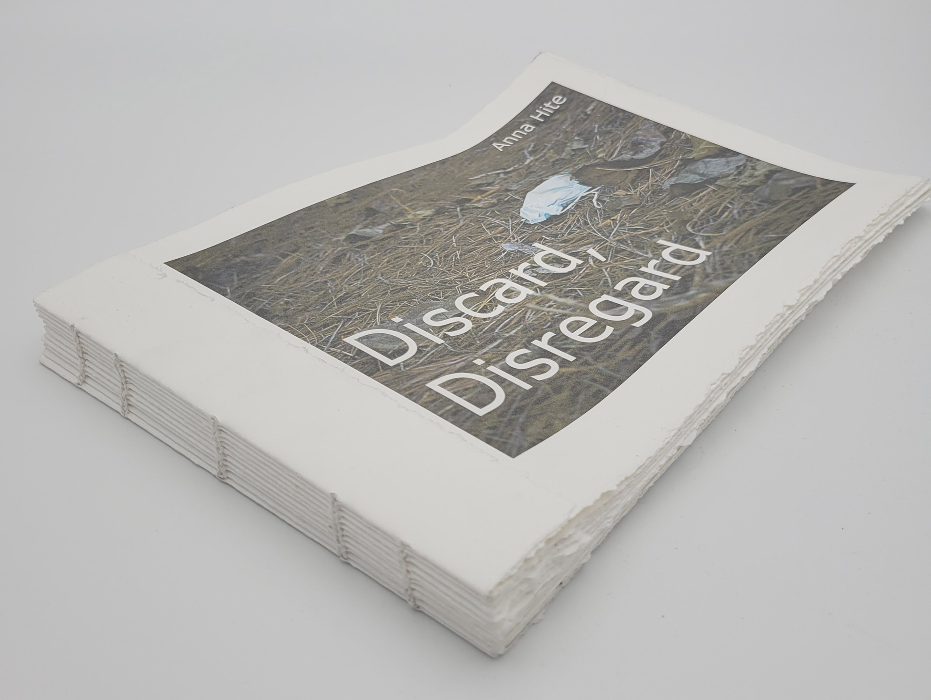 Discard, Disregard, 2021, coptic-stitch book with inkjet photographs on Stonehenge, 11x7.5x1"
