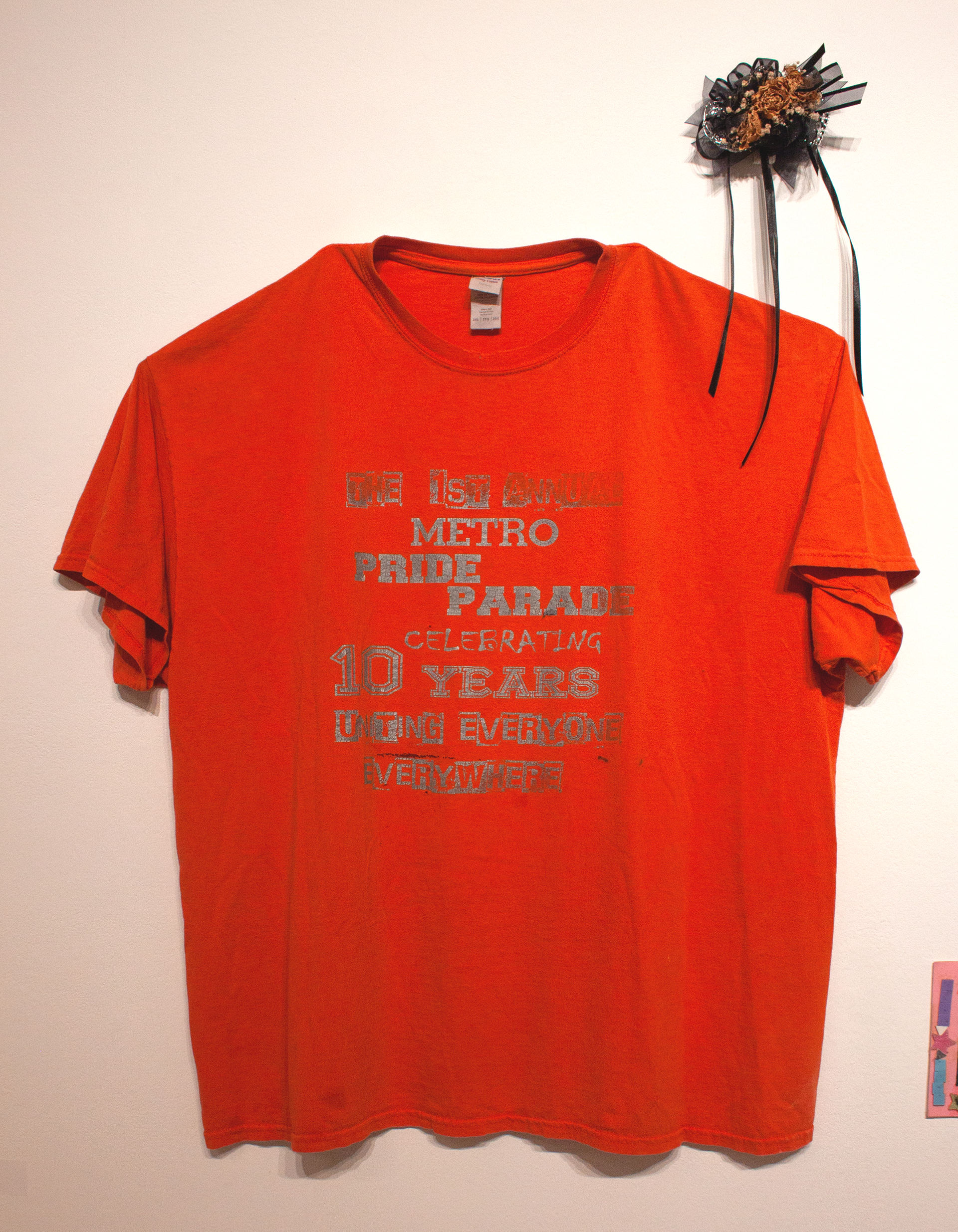 T-shirt from first Jackson Pride Parade and corsage from Jackson Pride Prom of the same year