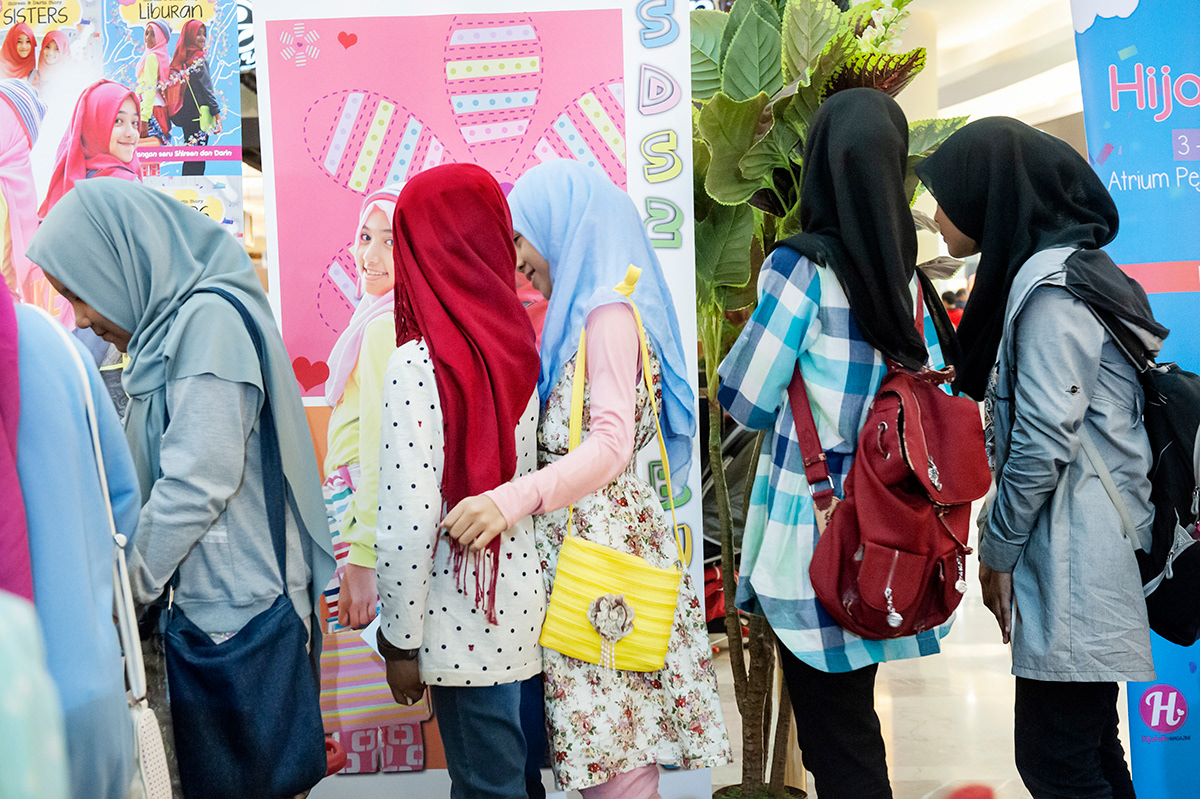 Young girls queuing to meet Shirin and Darin, two young bloggers at the launch of their book Liburan (Sisters), South Jakarta. The two sisters started wearing a hijab at the age of 9 and became popular through their posts on  Instagram about their life and daily activities.