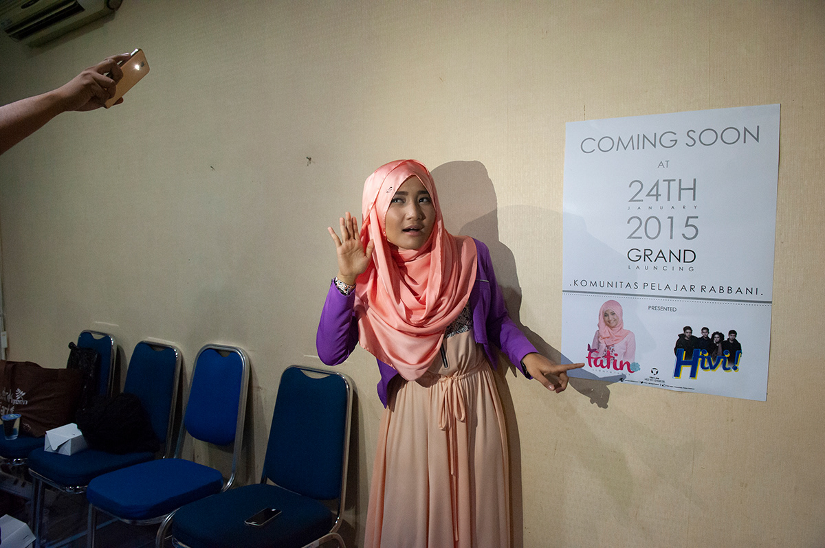 Singer Fatin Shidgia Lubis, filming a video message for her fans, MNC tv Studios, Jakarta Timur. In 2013 Fatin, fully supported by the Ulama Council of Indonesia, participated and won X-Factor Indonesia. Fatin became the symbol of Indonesian modern Muslim, which adopts western culture and follows global trends without loosing her identity.