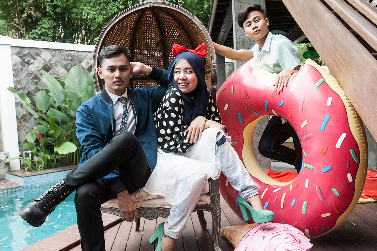 Tata, blogger and fashion editor of “Hijabella”, a lifestyle magazine for teenagers, with her assistants in South Jakarta.