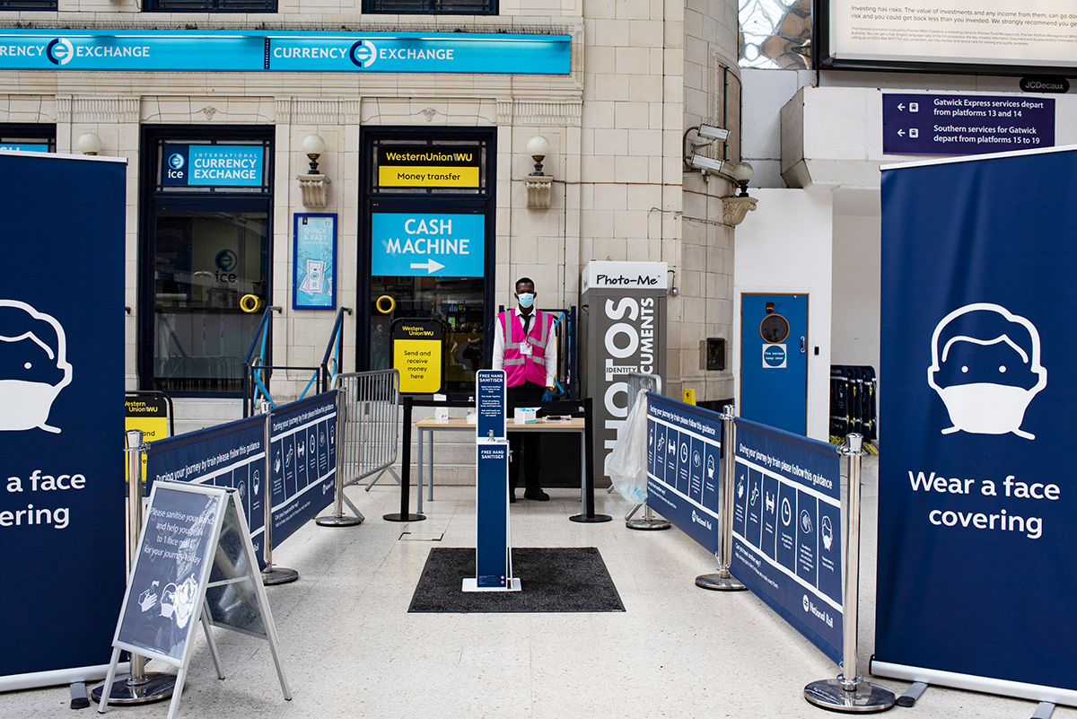 Stall with hand sanitiser and mask, London Victoria station, Central London.  Stations have been reorganised, after lockdown measures were eased, 