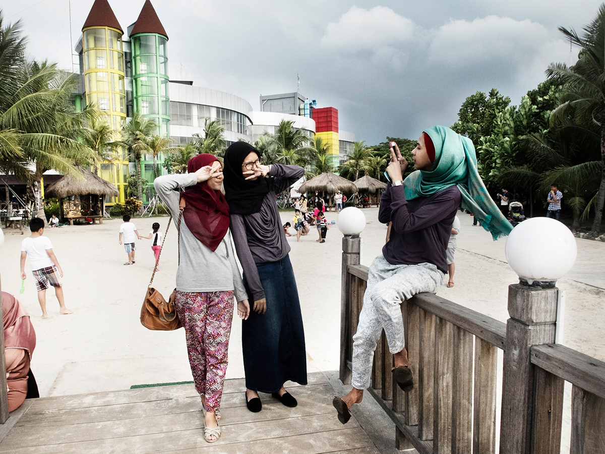Girlfriends during Eid holiday in a seaside resort, Ancol, Jakarta.