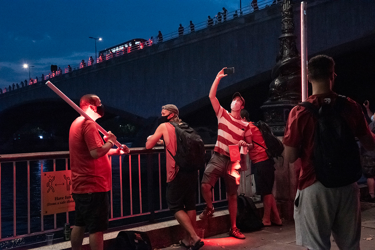 People shine red lights along the Thames as part of the “ WeMakeEvents” campaign, SouthBank, South London.  On August 11th, venues in London and across the UK have been lit up in red to show the event’s industry needs support. Live events have been devastated, from major festivals and landmark theatres, to grassroots venues and business events. This includes a huge supply chain ranging from production, audio, lighting and video, to logistics, planning, transportation, etc.  It’s over a million the number of professionals at risk of losing their jobs across the arts sector, from which around 70 per cent is freelance. Unlike other industries, events, festivals, and performances have been unable to safely reopen due to social distancing guidance, and may not reopen until early 2021 