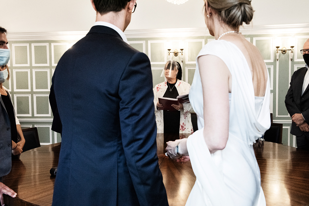 Civil registrar ceremony, Bromley civic centre,Bromley, South London. The range of Government guidelines about marriage ceremony, go from keep the ceremony as short as possible, to keeping the number of attendees at the minimum, maintaining the capacity of the venue at a level that allows social distancing, till avoid singing to mitigate the potential for increased risk of transmission from droplets and aerosol transmission. The spouses are the only ones exempted to use face covering.