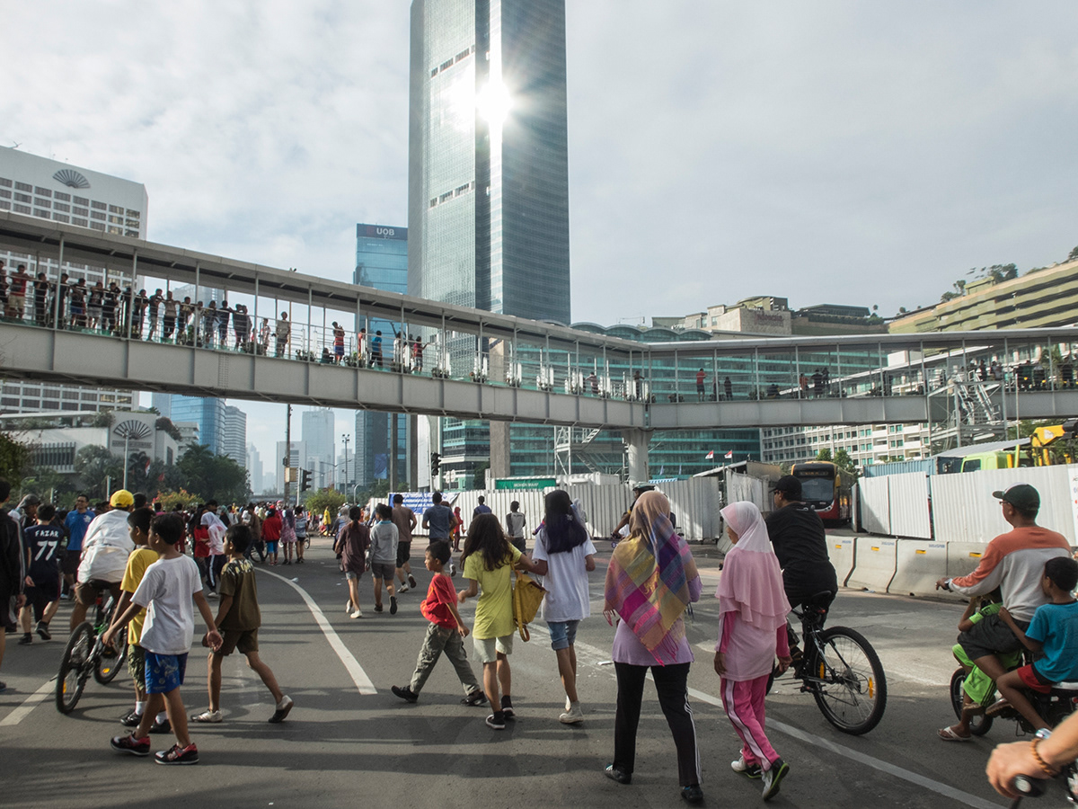 Car-free Sunday, Hotel Indonesia traffic circle, Jakarta. Since 2012 Car-free day is held every Sunday on the main avenues of the city from 6am to 11am as a weekly public activity aiming to reduce carbon emission and allowing residents to exercise or walk around the area.