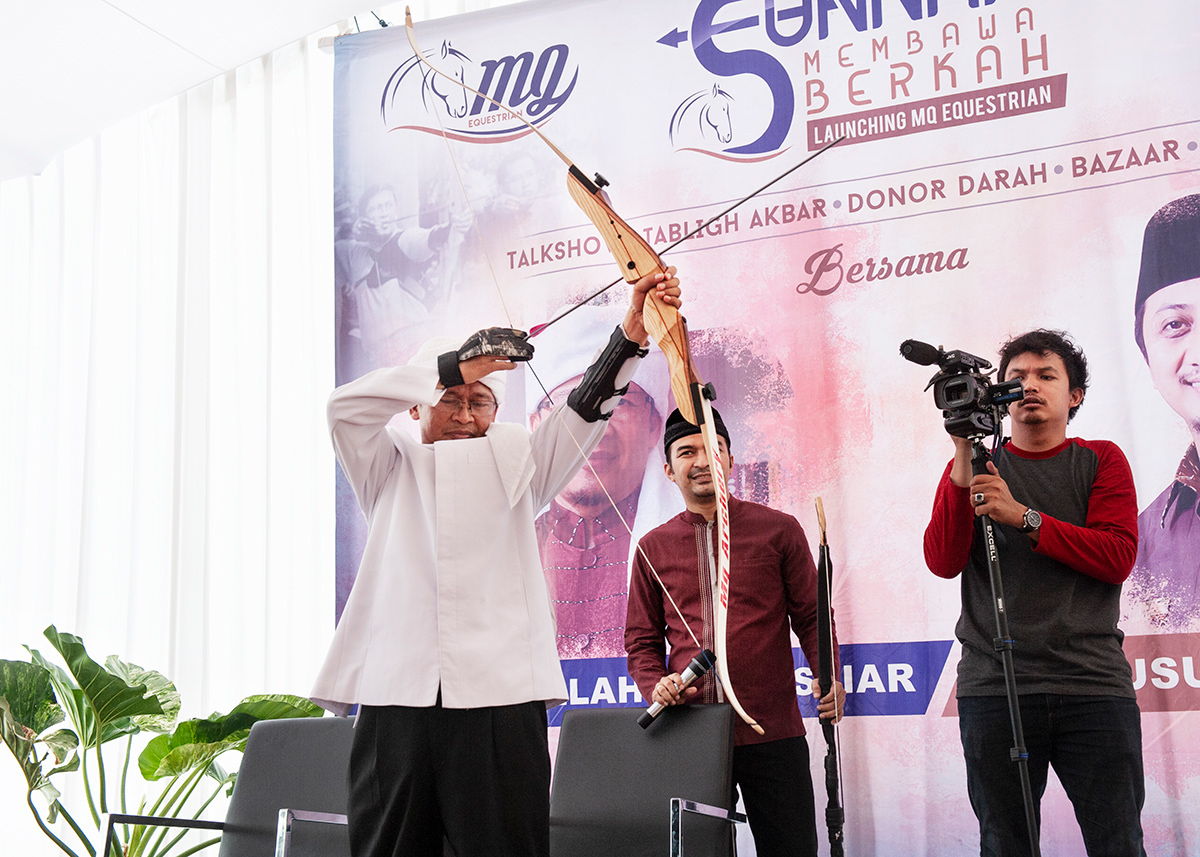  Television preacher AA Gym showing his archery skills, Eco Pesantren, Daarut Tauhid, West Bandung, West Java. Known for his humorous sermons and self help messages, AA Gym was the most adored Indonesian preacher. He gained success targeting the middle class through television programmes and self-help psychology books. At the peak of his public adoration, he took the path of polygamy which provoked a national scandal and the crumbling of his empire.  He’s now trying to reposition himself and rebranding his religious products.  Although polygamy is legal, Indonesian law makes it extremely difficult to practice.