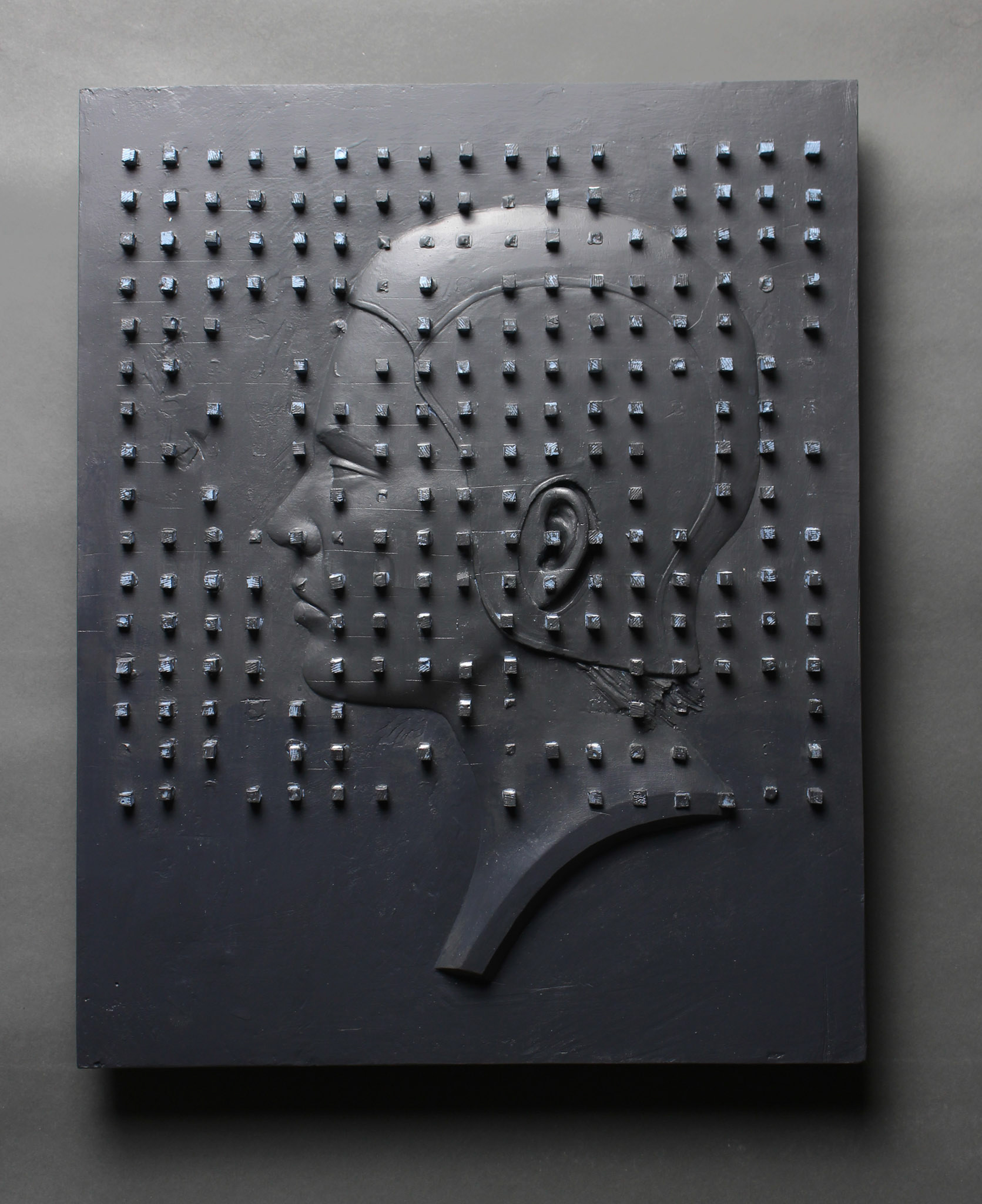 “The City At Night”, 2019, plaster, paint, 13.75”w x 17.25”h x 1.5”d
