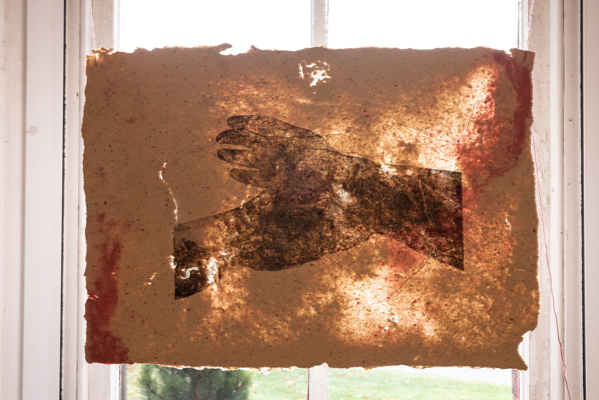 Savannah Flores, Warmth, 2023. Intaglio with water marbled Soft-ground on Cochineal (Pink/Red tones) paper Pulp painted onto Corn Husk Abaca and Cotton Paper, 20” x 30.”