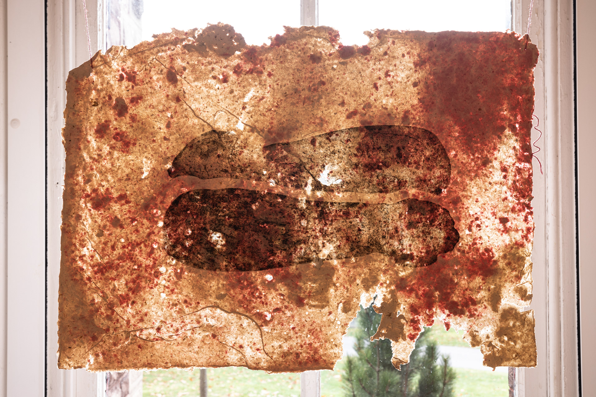 Savannah Flores, Warmth, 2023. Intaglio with water marbled Soft-ground on Cochineal (Pink/Red tones) paper Pulp painted onto Corn Husk Abaca and Cotton Paper, 20” x 30.”
