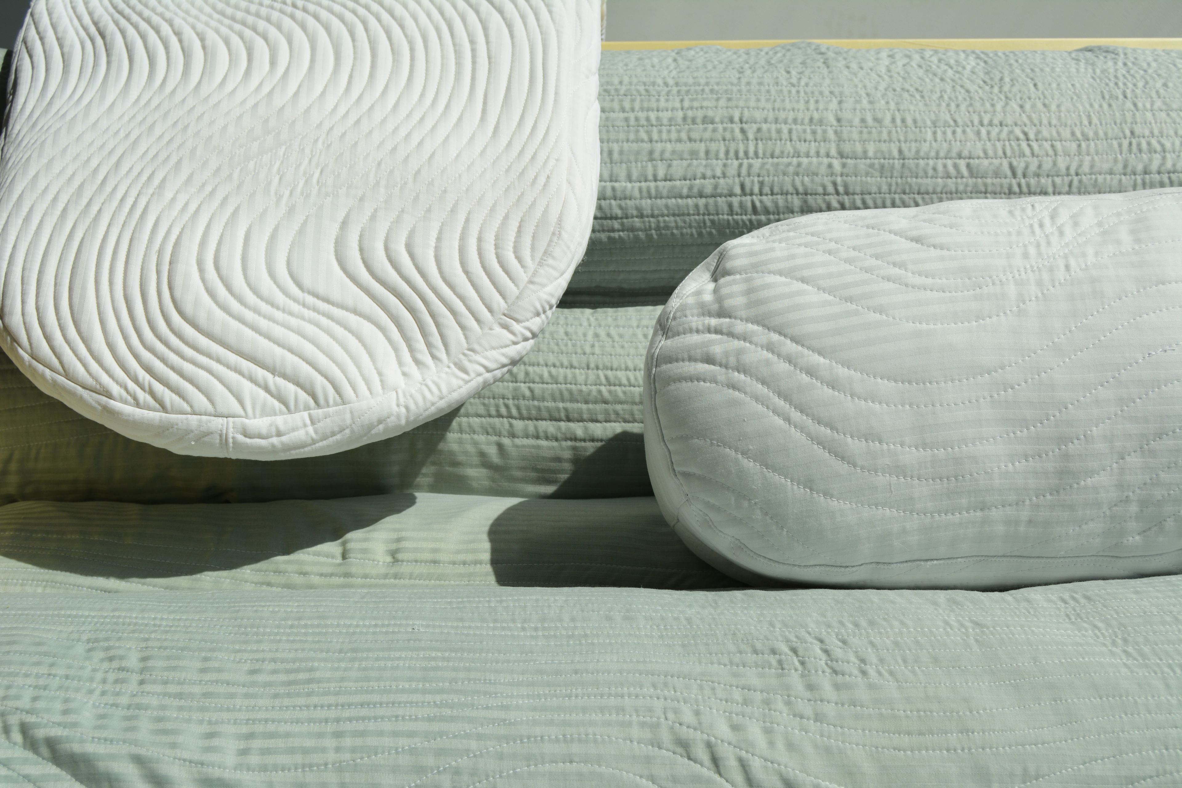 quilted pillows and couch covering