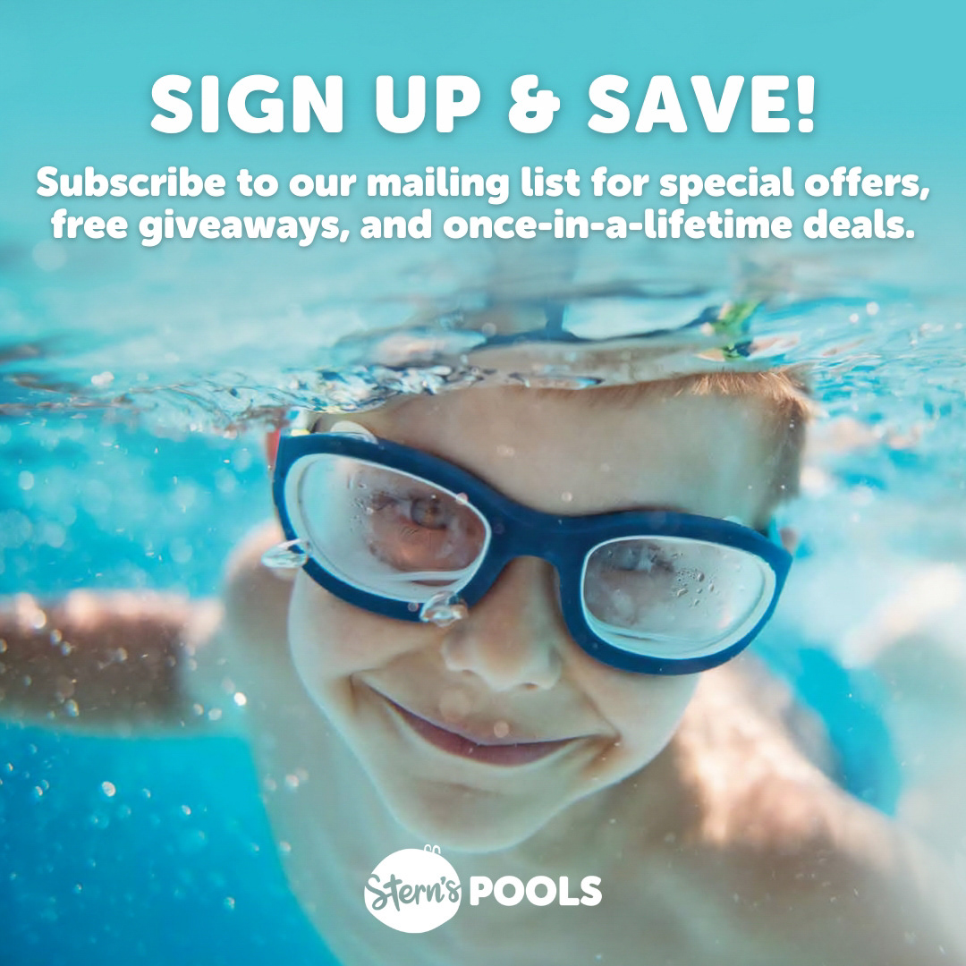 Child in pool wearing gogles