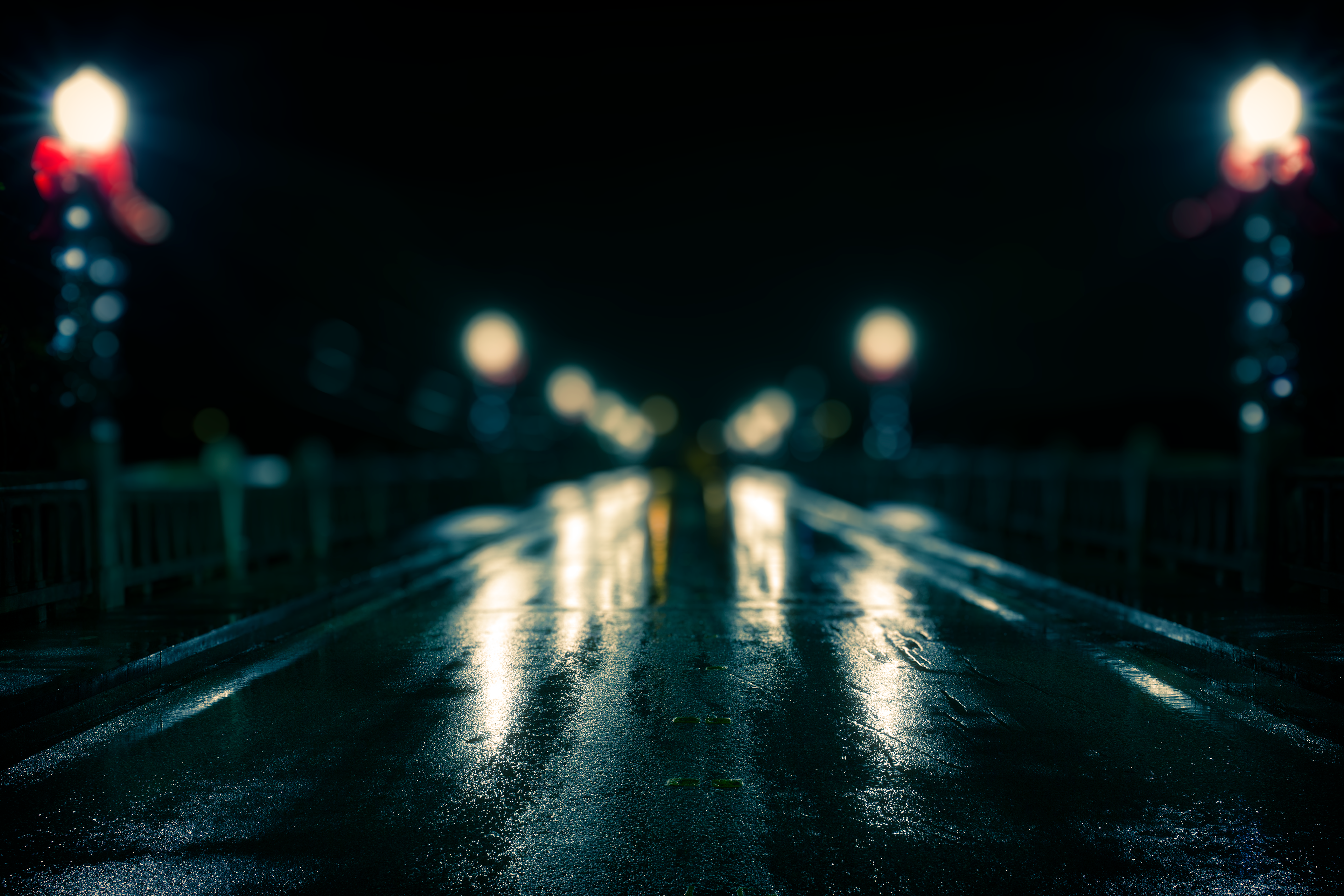 Street lights, wet roads, and bokeh. This was taken over the Comal River bridge in New Braunfels, TX. 