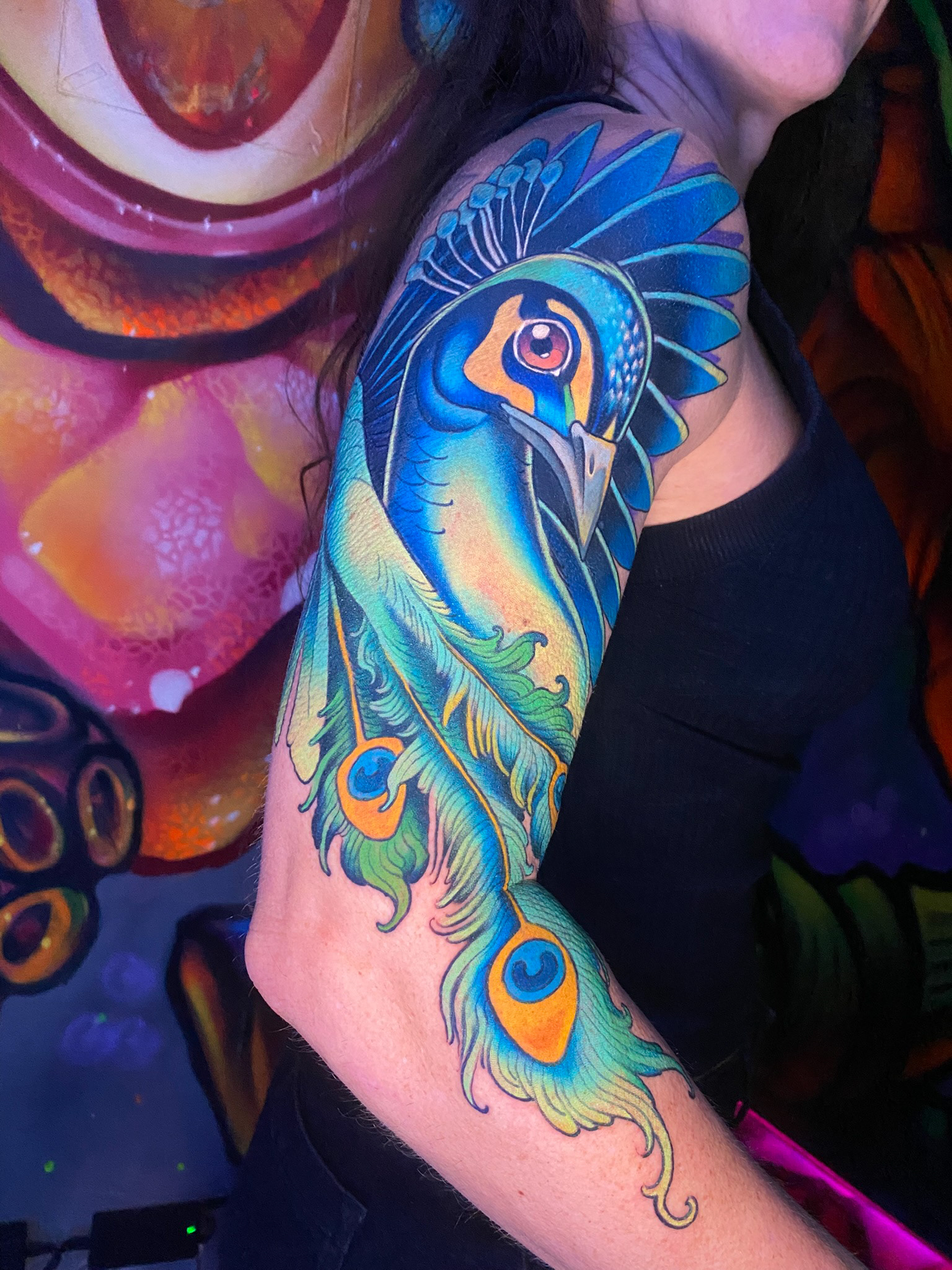 tatuagem colorida de pavão 