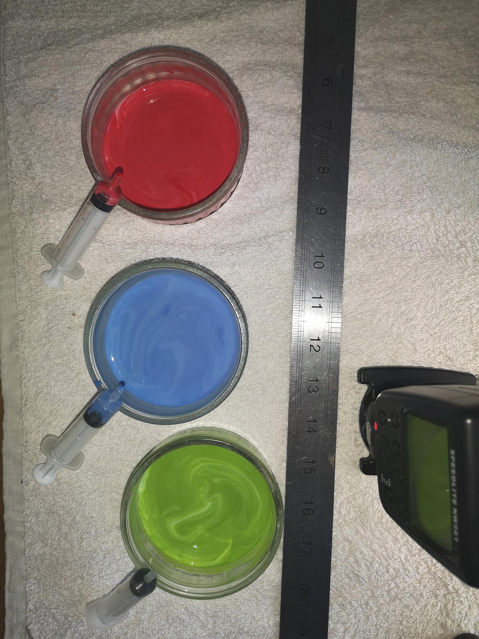 mixed cream with syringe and ruler