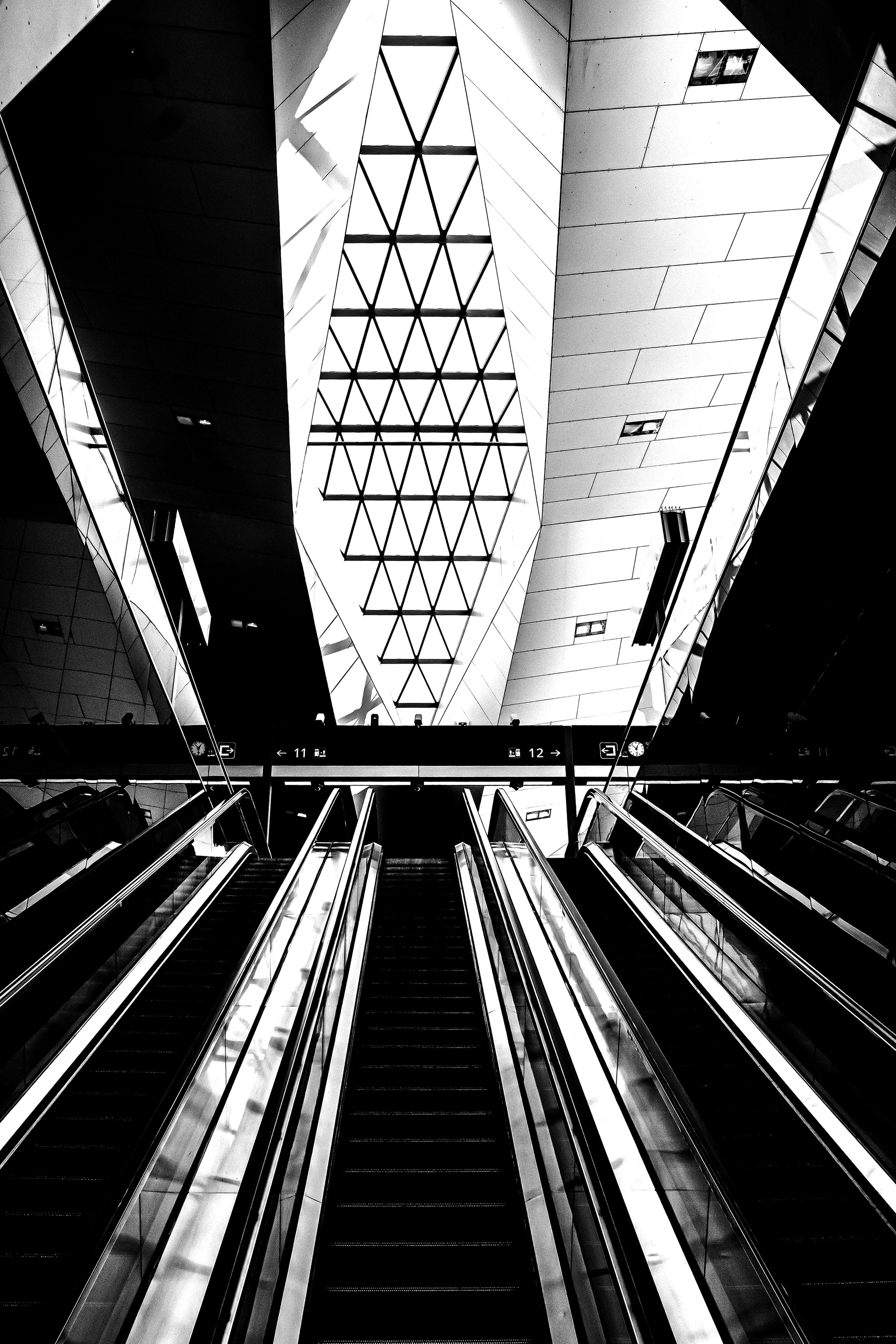 Escalators at Vienna Central Railway Station during the 2020 COVID-19 lockdown – empty station interior with modern architecture and no passengers