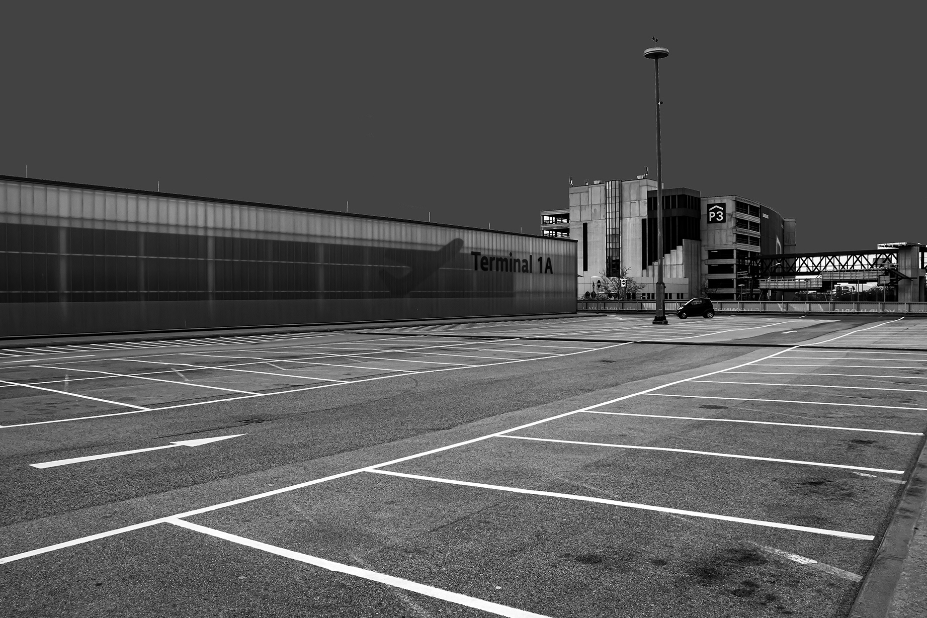 Empty check-in area at Vienna International Airport during the 2020 COVID-19 lockdown – deserted terminal with self-service kiosks and no passengers