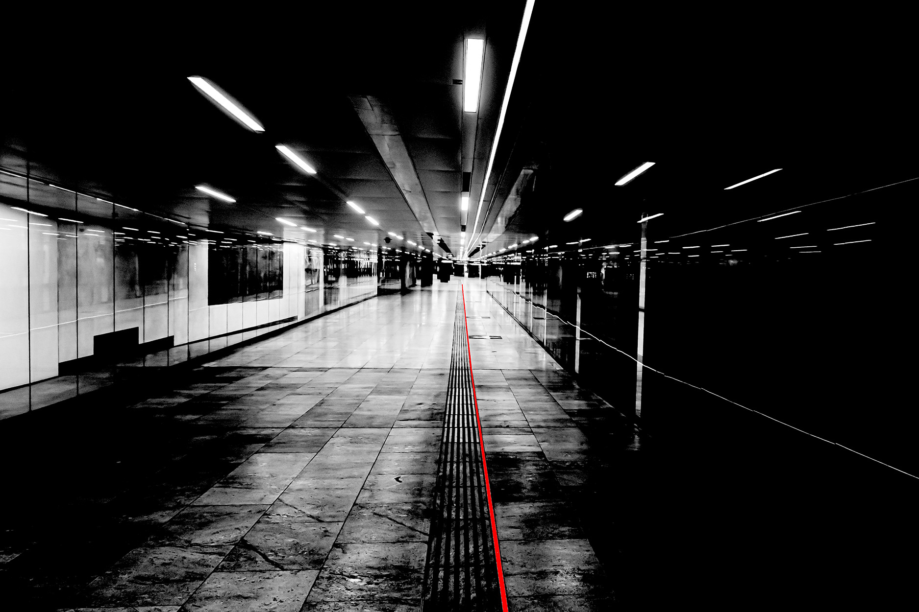 Empty underground passage at Karlsplatz in Vienna during the 2020 COVID-19 lockdown – deserted walkway with leading line and no people