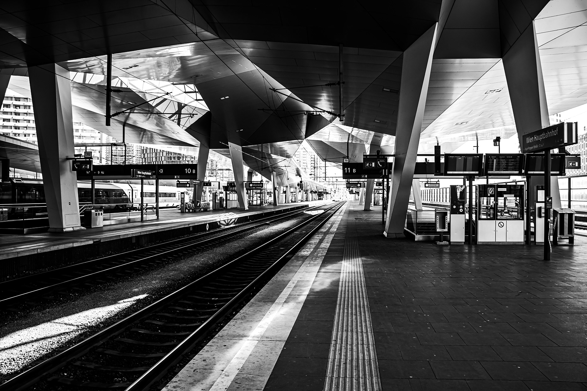 Escalators at Vienna Central Railway Station during the 2020 COVID-19 lockdown – empty station interior with modern architecture and no passengers