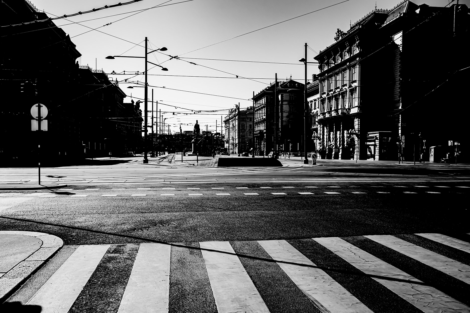 Empty Schwarzenbergplatz in Vienna during the 2020 COVID-19 lockdown – deserted city square with crosswalk and historic buildings, no pedestrians or traffic