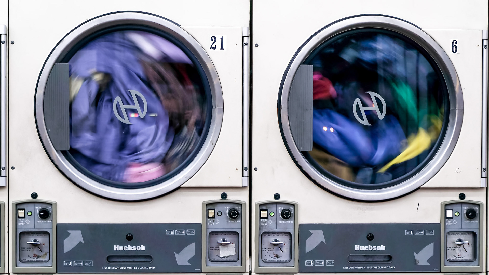 Dryers spinning at a coin laundry on NW 7th Ave
